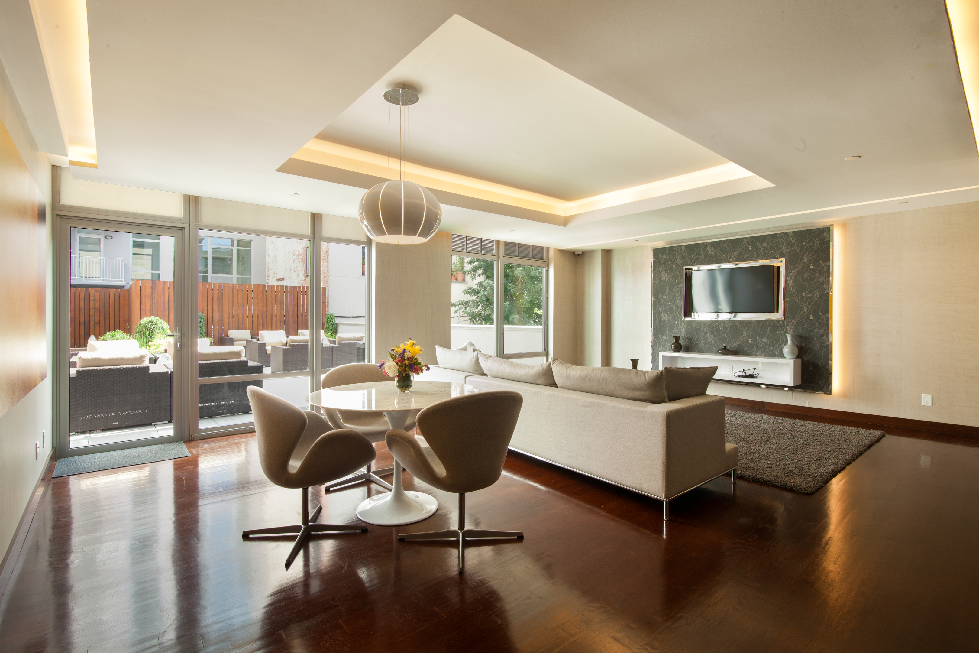 267 6th Street, Unit 6J Brooklyn, NY 11215 - Photo 10 of 15 a living room with furniture and a large window