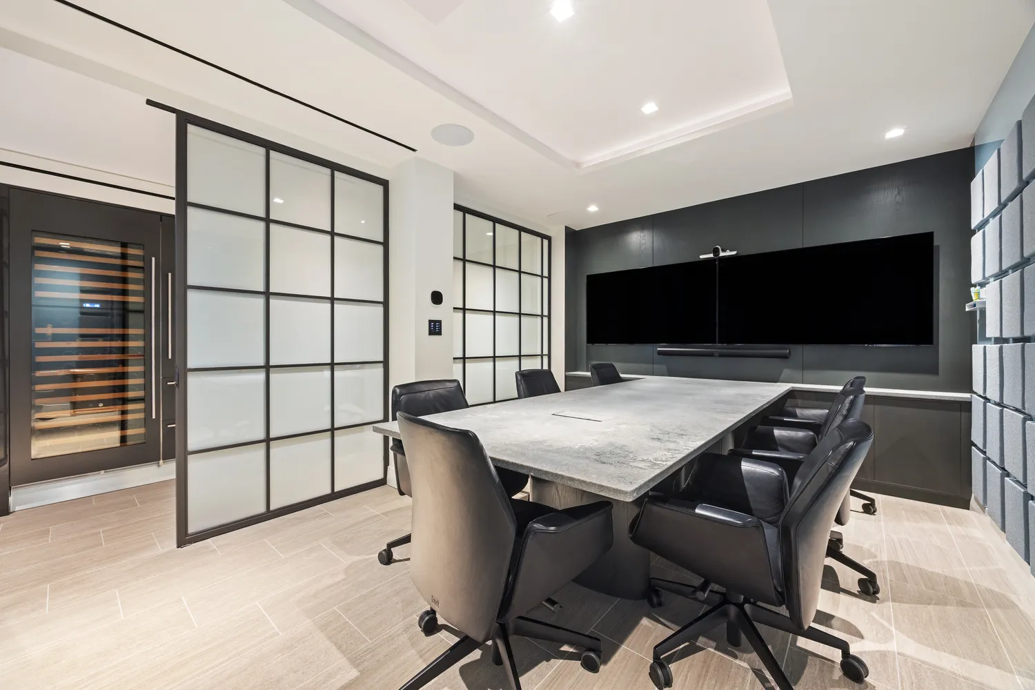 a spacious bedroom with a bed and a flat screen television