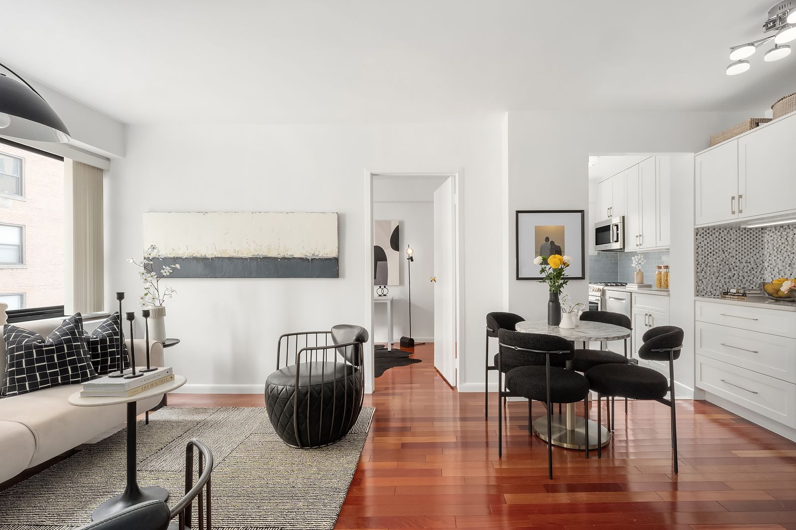 a view of a dining room with furniture and wooden floor