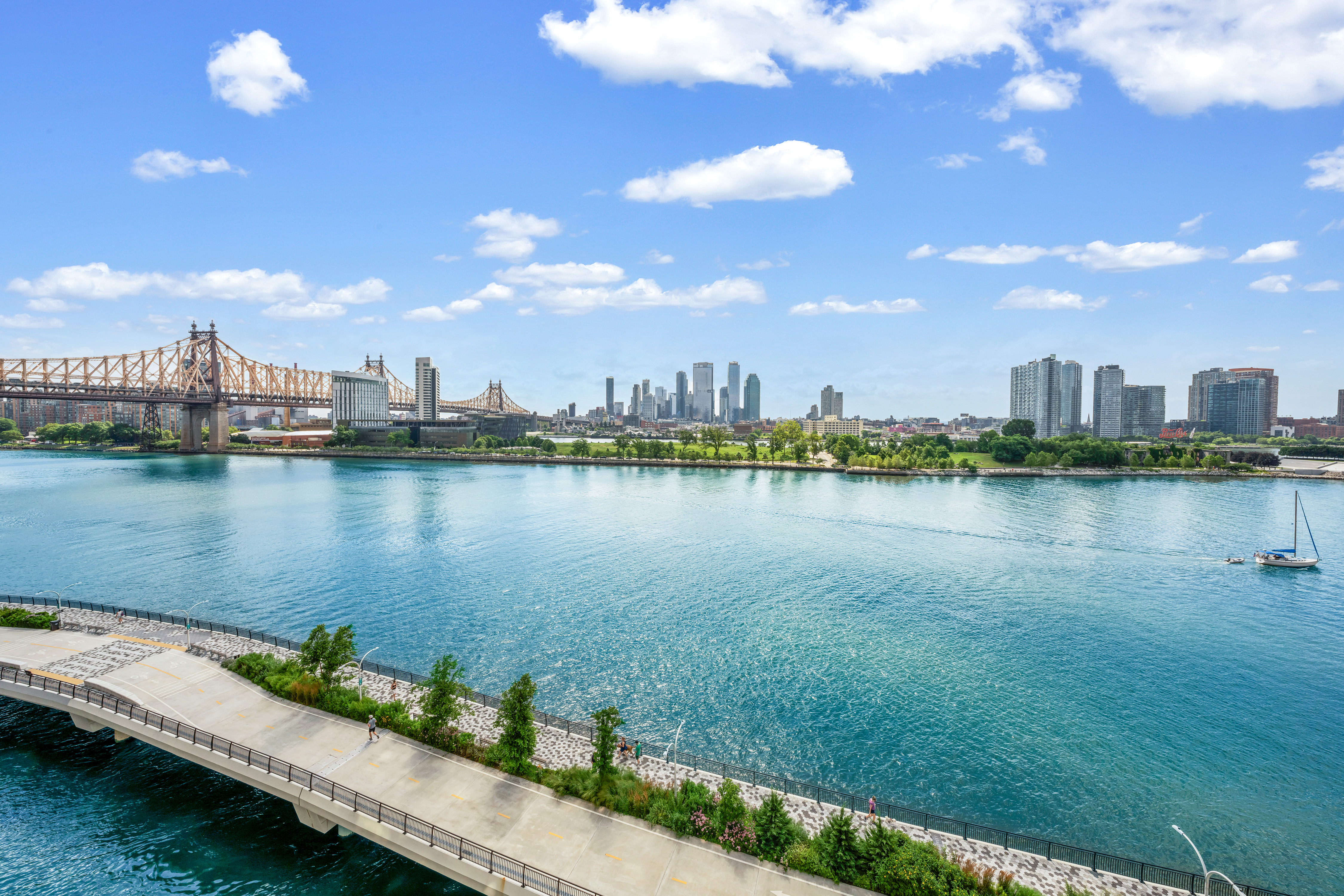 45 Sutton Place South, Unit 8L Manhattan, NY 10022 - Photo 20 of 22 a view of a lake with a city