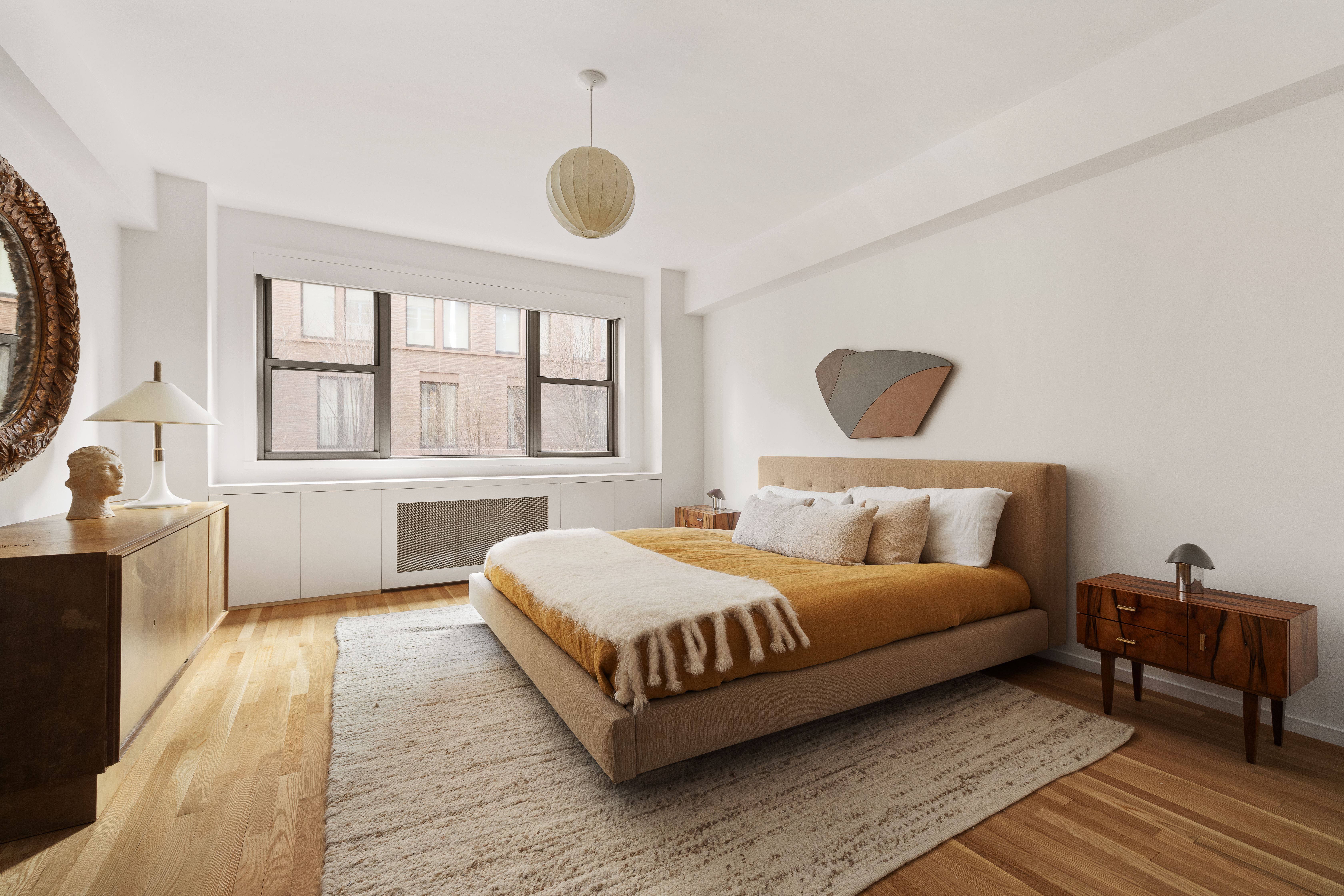 2 Horatio Street, Unit 2PR Manhattan, NY 10014 - Photo 8 of 14 a bedroom with a bed and a large window