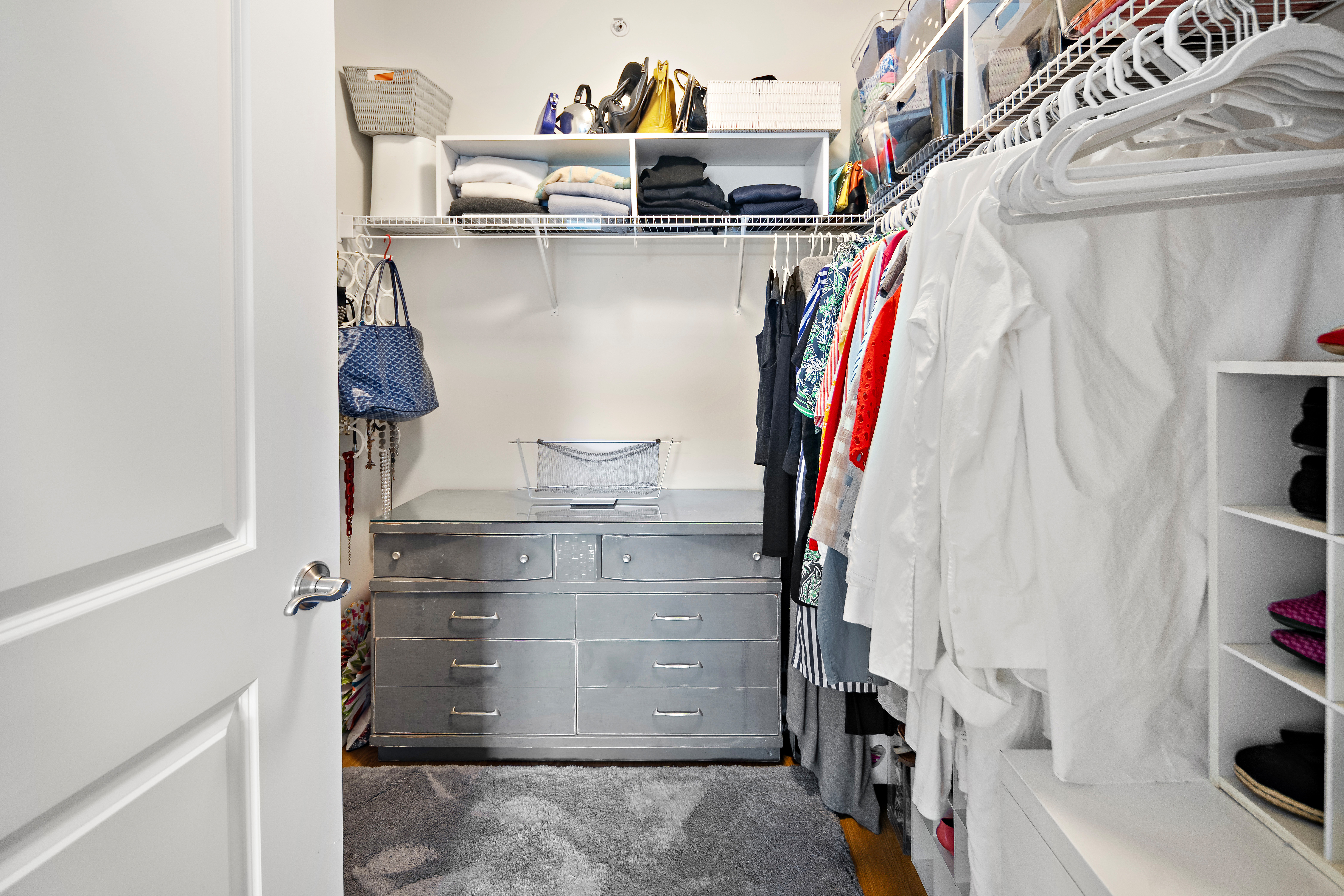 107 Clocktower Drive, Unit 407 Waltham, MA 02452 - Photo 12 of 19 a view of walk in closet with clothes and shoes