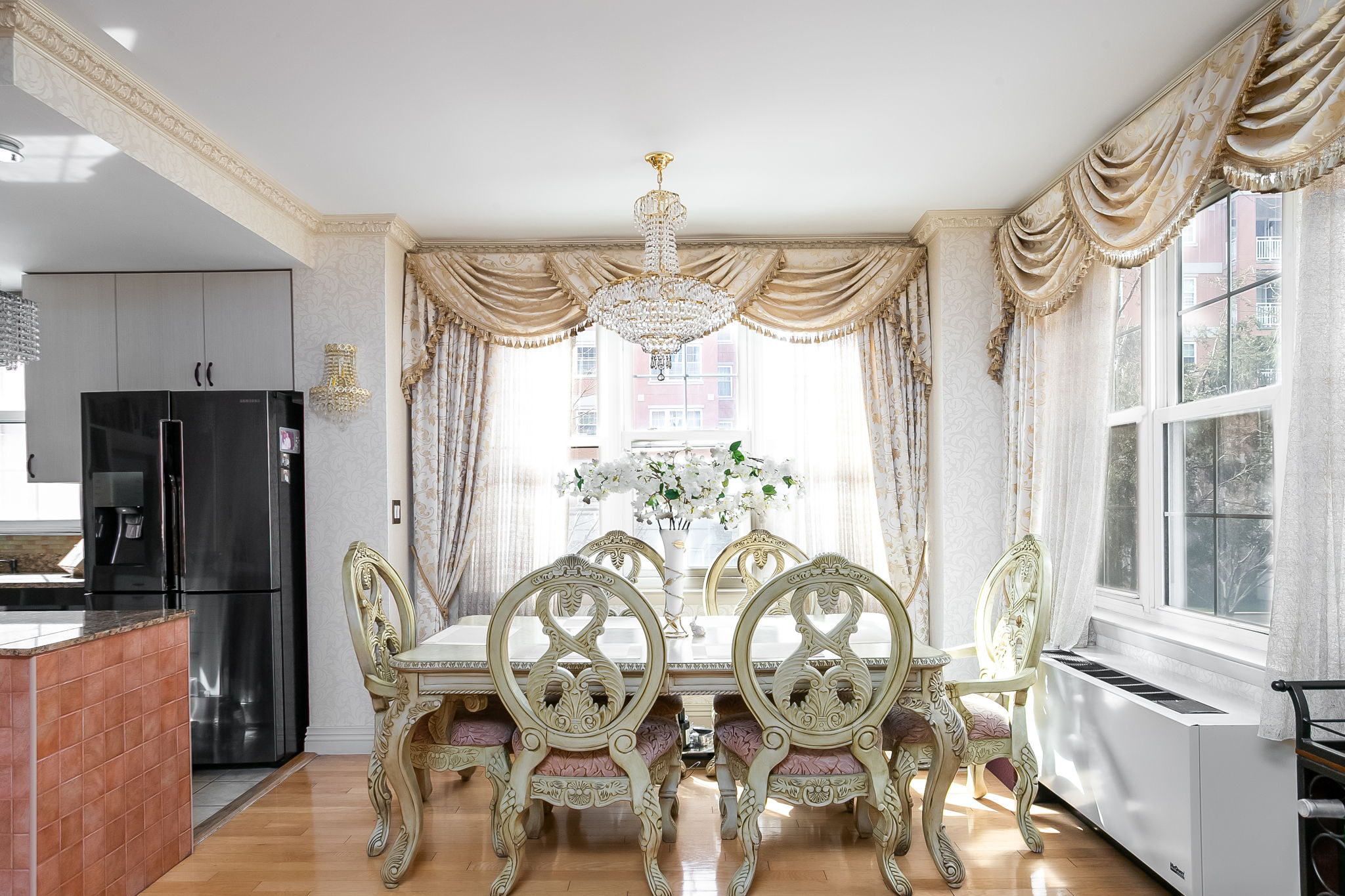 135 Oceana Drive East, Unit 2C Brooklyn, NY 11235 - Photo 5 of 29 a view of a dining room with furniture a chandelier and wooden floor