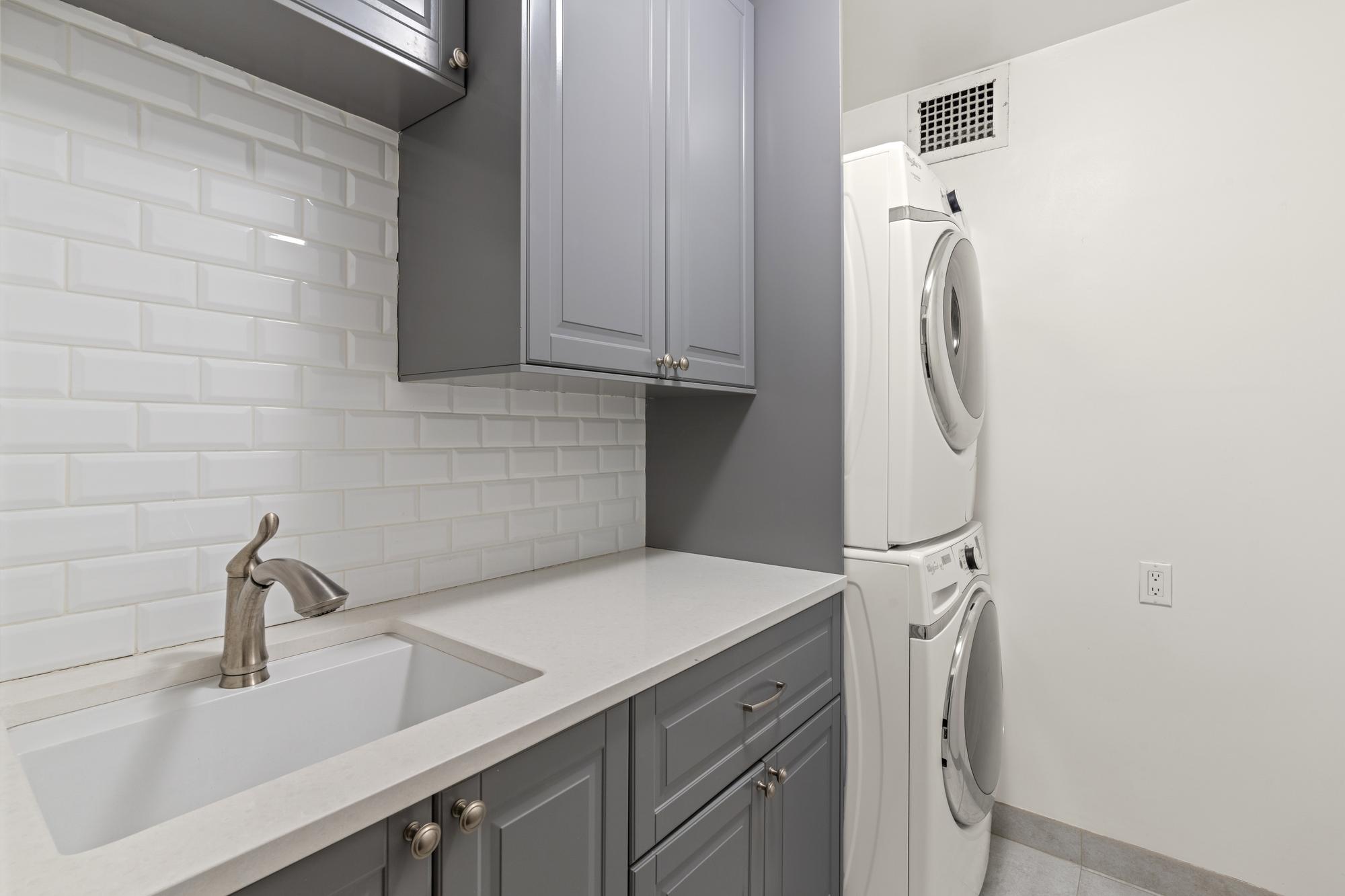 345 East 73rd Street, Unit 11KL Manhattan, NY 10021 - Photo 7 of 12 a view of a sink and washer in a kitchen