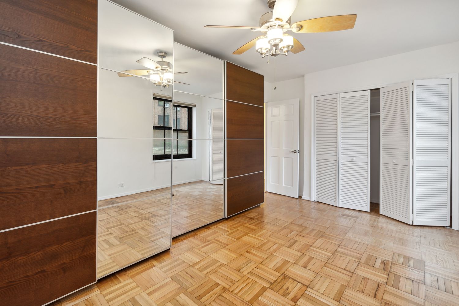 355 Clinton Avenue, Unit 1F Brooklyn, NY 11238 - Photo 12 of 14 a view of an empty room with a window