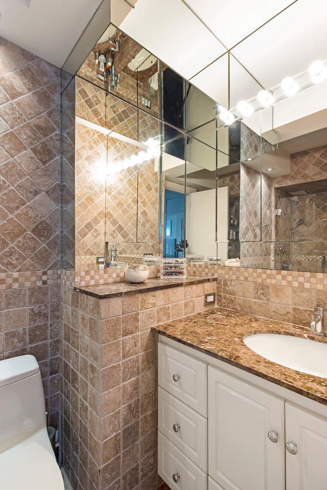 520 East 76th Street, Unit PHC Manhattan, NY 10021 - Photo 13 of 15 a bathroom with a granite countertop sink a toilet and a mirror