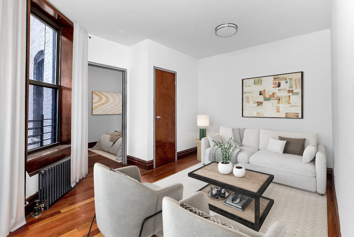 1392 Madison Avenue, Unit 4 Manhattan, NY 10128 - Photo 1 of 4 a living room with furniture