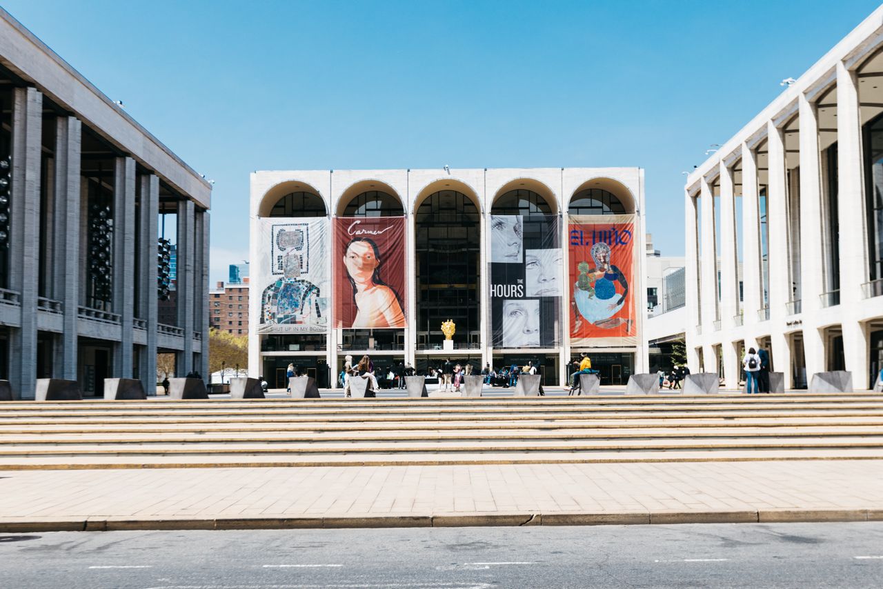 a group of people sitting on a street