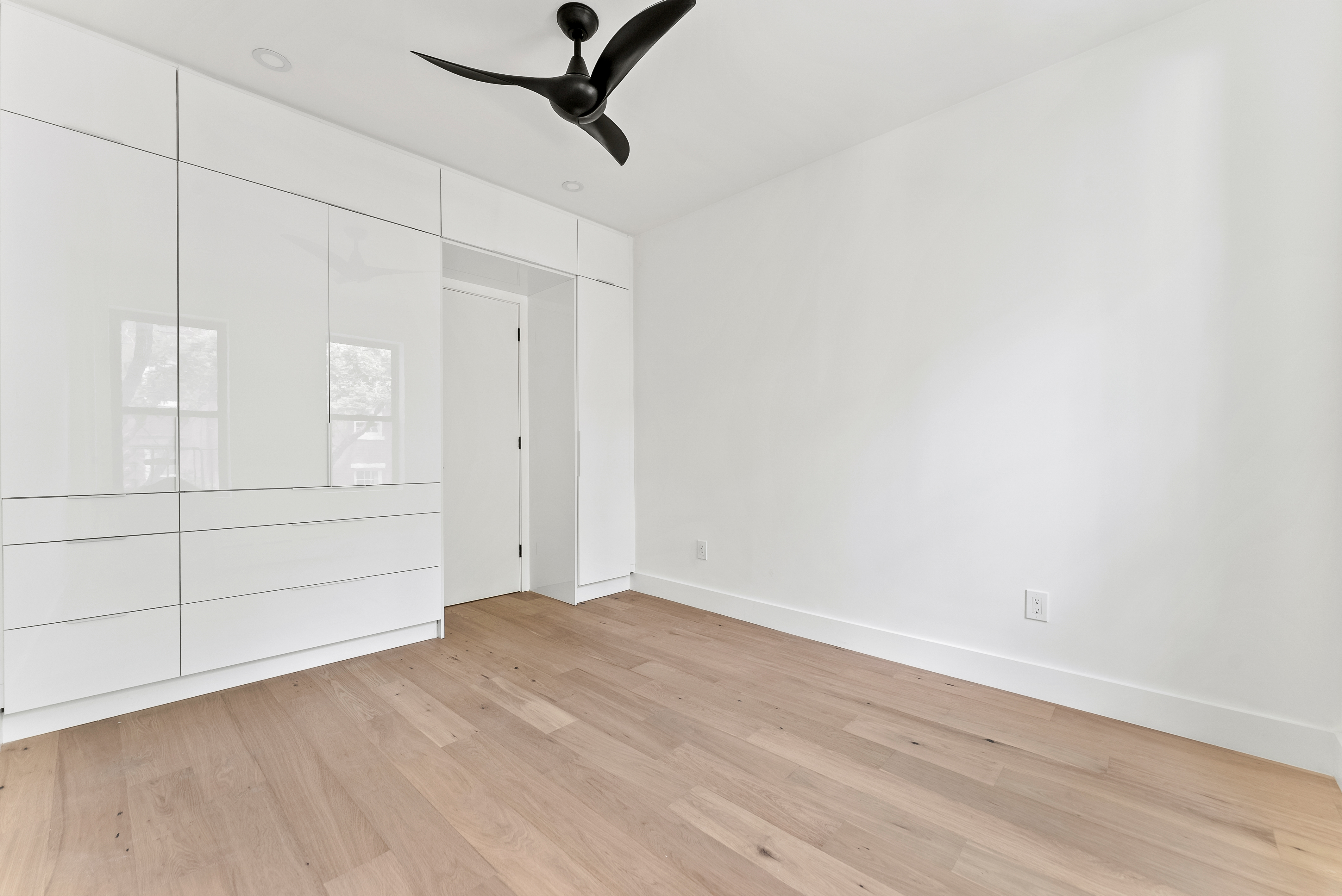 342 West 21st Street, Unit 3E Manhattan, NY 10011 - Photo 8 of 10 wooden floor in an empty room