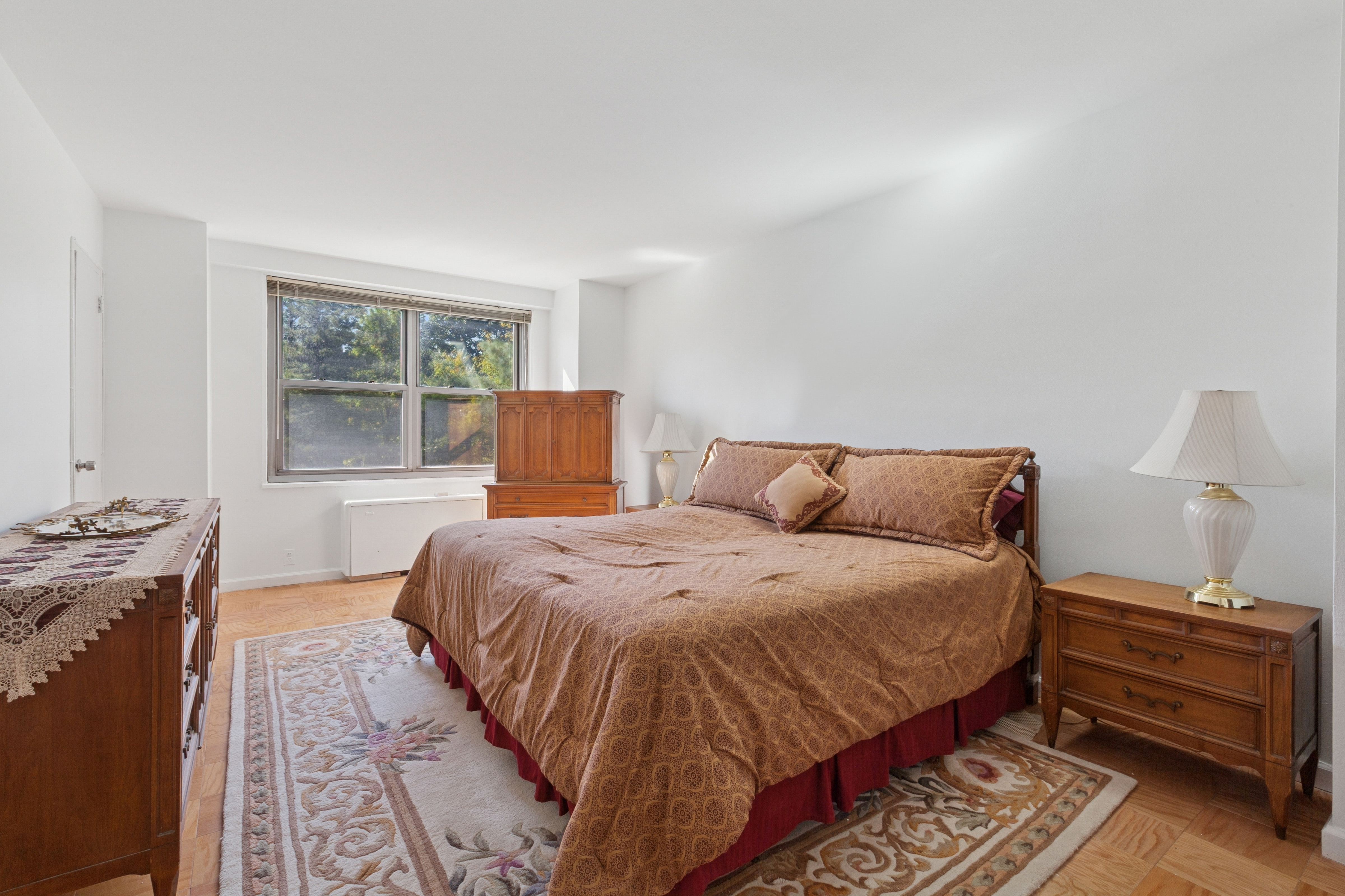 70-25 Yellowstone Boulevard, Unit 2M Queens, NY 11375 - Photo 6 of 23 a bedroom with bed and window