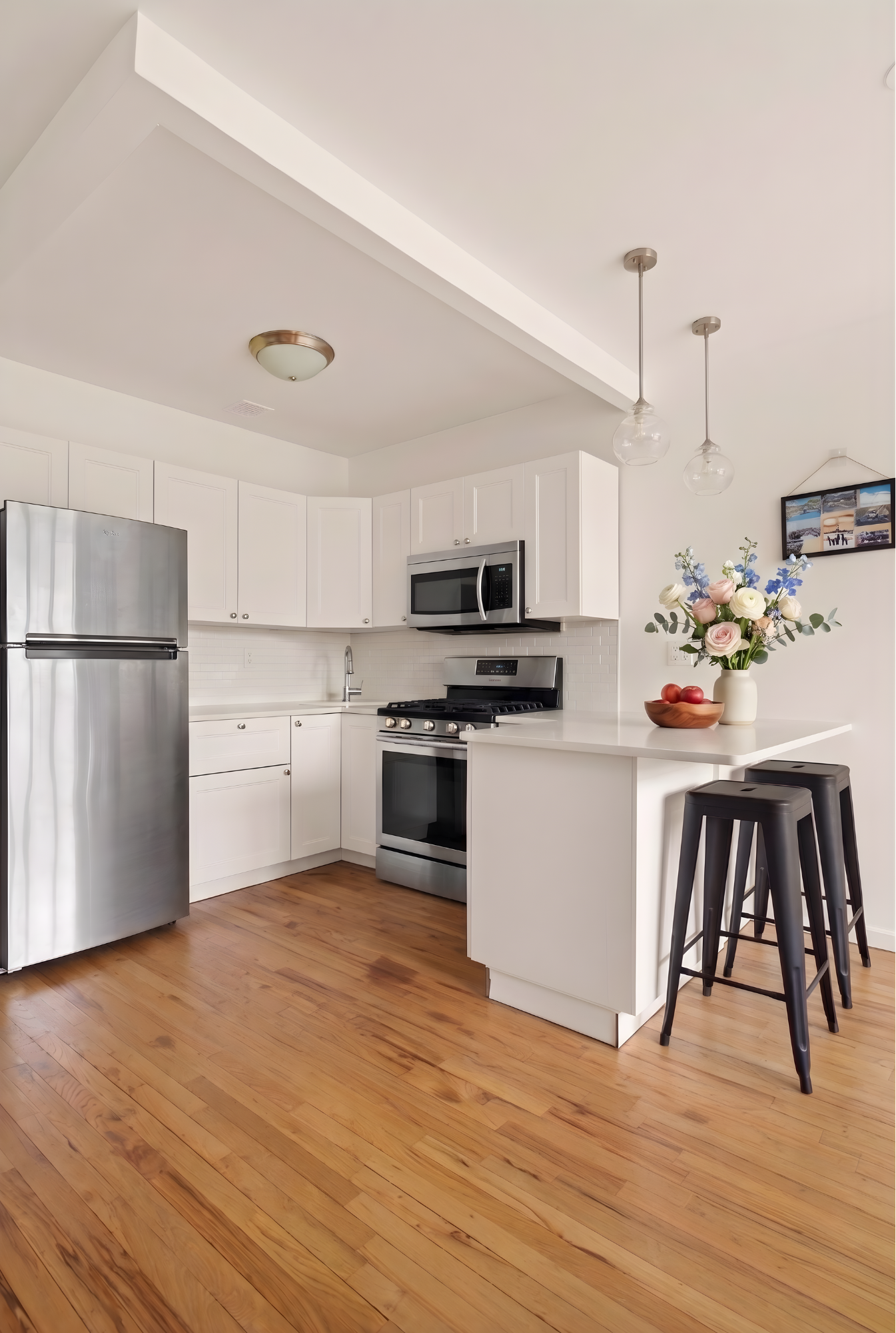 109 Pulaski Street Brooklyn, NY 11206 - Photo 7 of 14 a kitchen with a refrigerator and a stove top oven