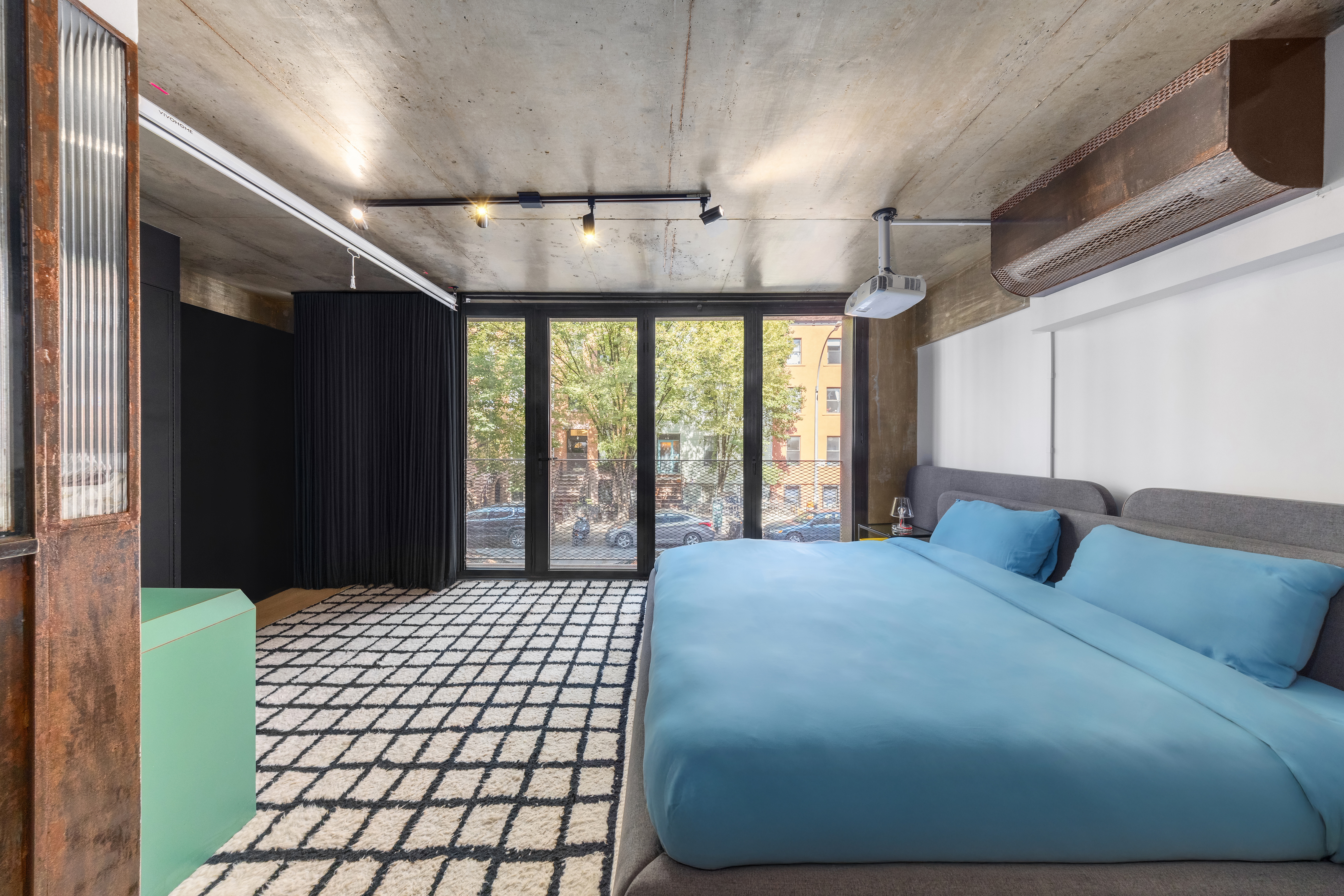 126 South 2nd Street, Unit GARDEN Brooklyn, NY 11249 - Photo 17 of 30 a bedroom with a bed mirror and window