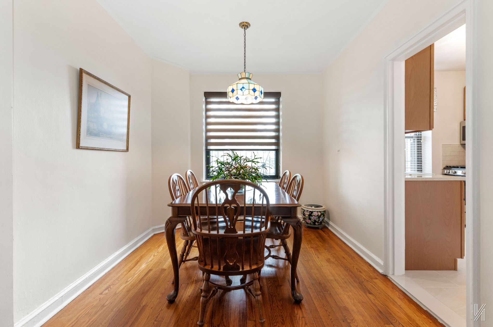 22-08 76th Street, Unit D2 Queens, NY 11370 - Photo 7 of 20 a view of a dining room with furniture window and wooden floor