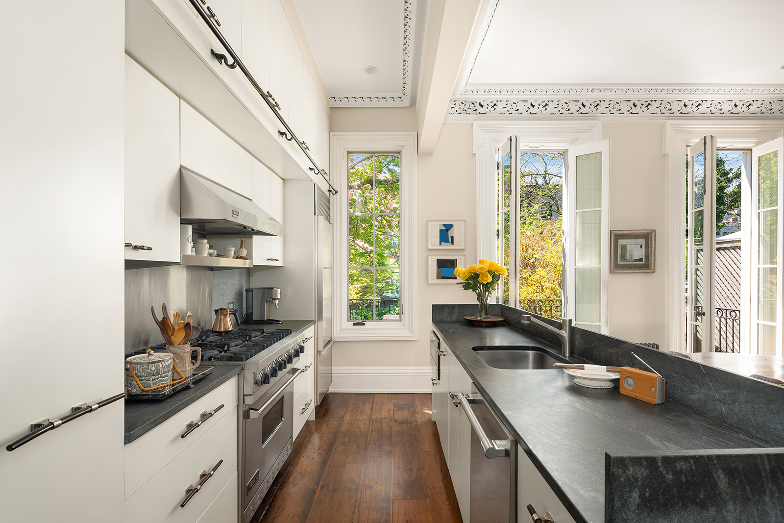 204 Warren Street Brooklyn, NY 11201 - Photo 5 of 29 a kitchen with stainless steel appliances a sink stove and cabinets