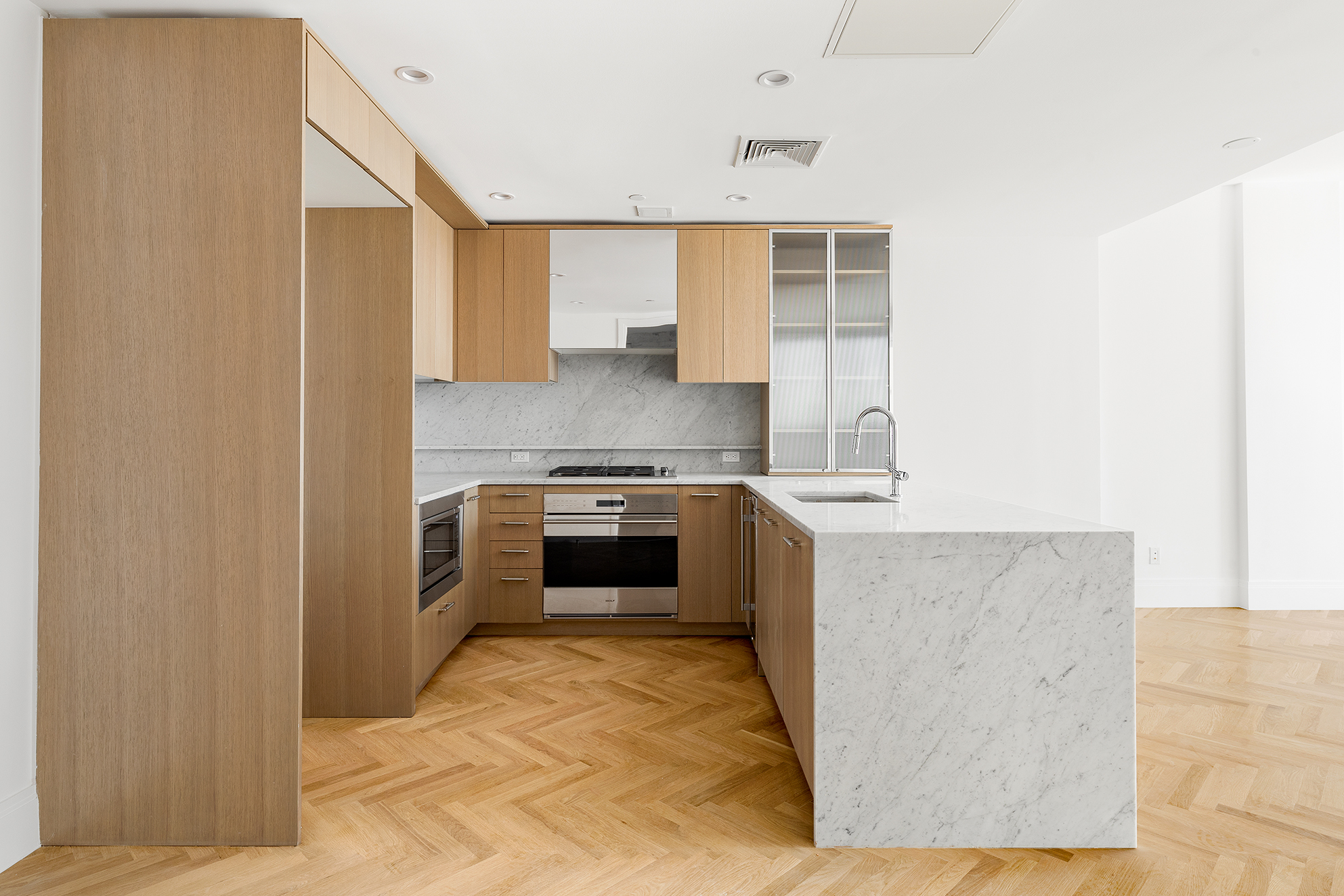 300 West 122nd Street, Unit 12C Manhattan, NY 10027 - Photo 1 of 11 a kitchen with a stove top oven and cabinets
