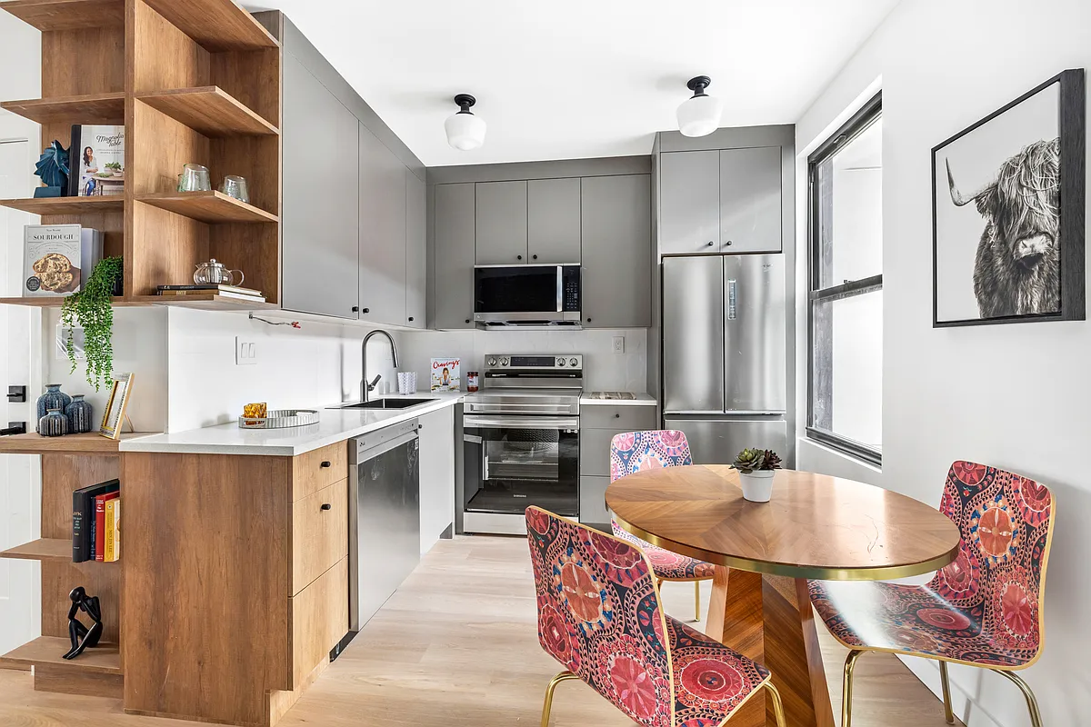 76 Meserole Avenue, Unit 2A Brooklyn, NY 11222 - Photo 4 of 10 a kitchen with stainless steel appliances a stove top oven a sink and a refrigerator