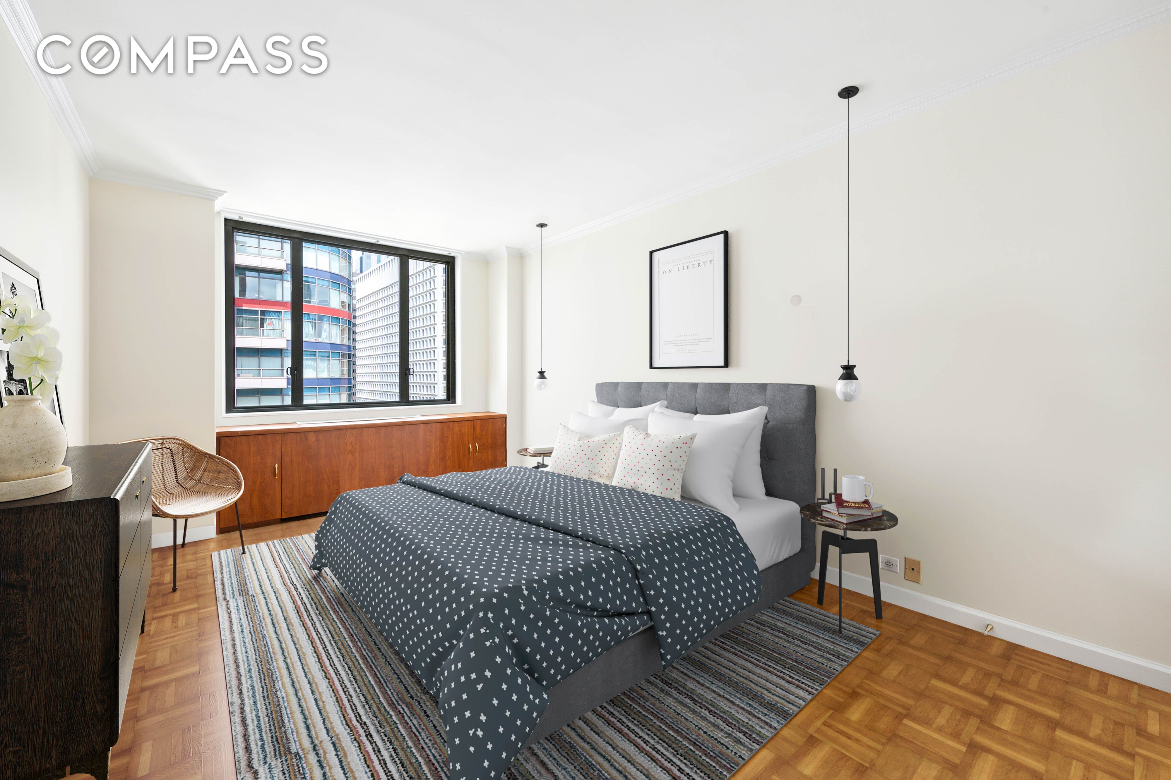 300 East 54th Street, Unit 34GF Manhattan, NY 10022 - Photo 5 of 16 a bedroom with a bed and wooden floor