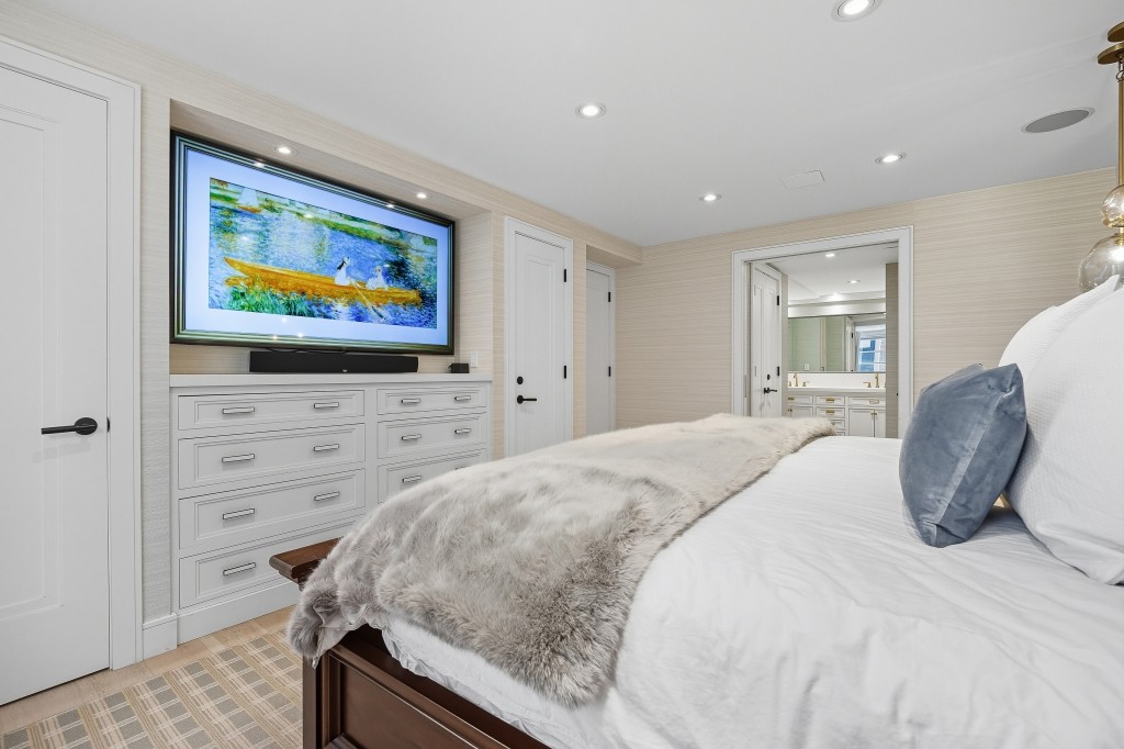 433 West 34th Street, Unit 4ABC Manhattan, NY 10001 - Photo 16 of 20 a bedroom with a bed and a flat screen tv