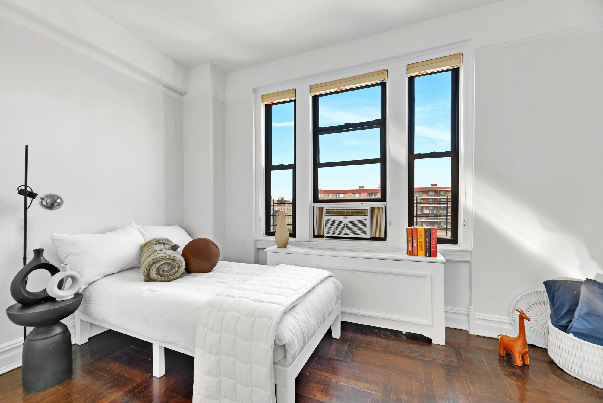 41 West 96th Street, Unit 15D Manhattan, NY 10025 - Photo 8 of 13 a bedroom with a bed and wooden floor