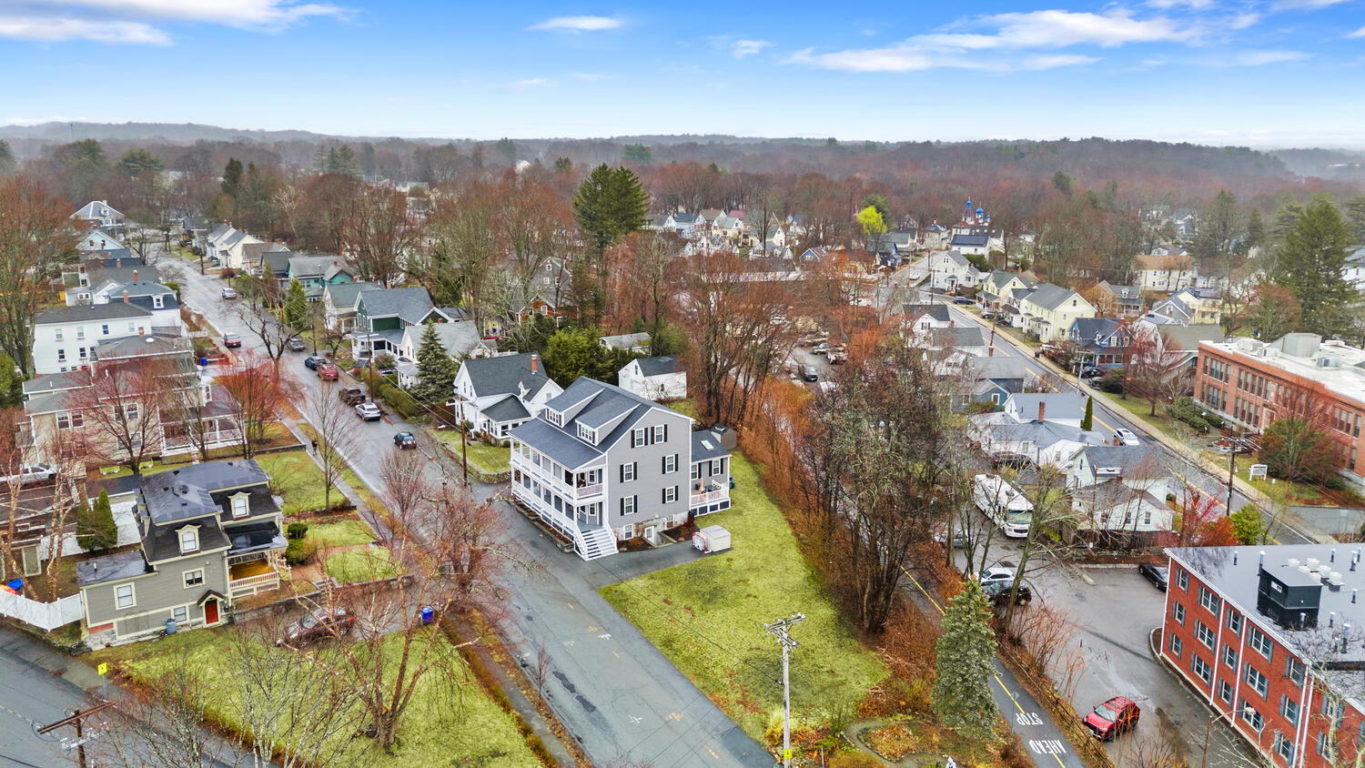 1 Maple Street, Unit 1 Maynard, MA 01754 - Photo 34 of 42 a view of a city with tall buildings