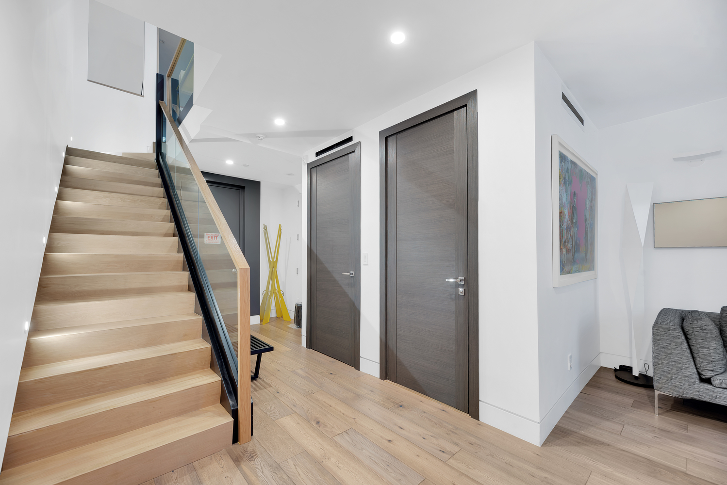440 West 20th Street Manhattan, NY 10011 - Photo 20 of 35 a view of entryway with wooden floor and stairs