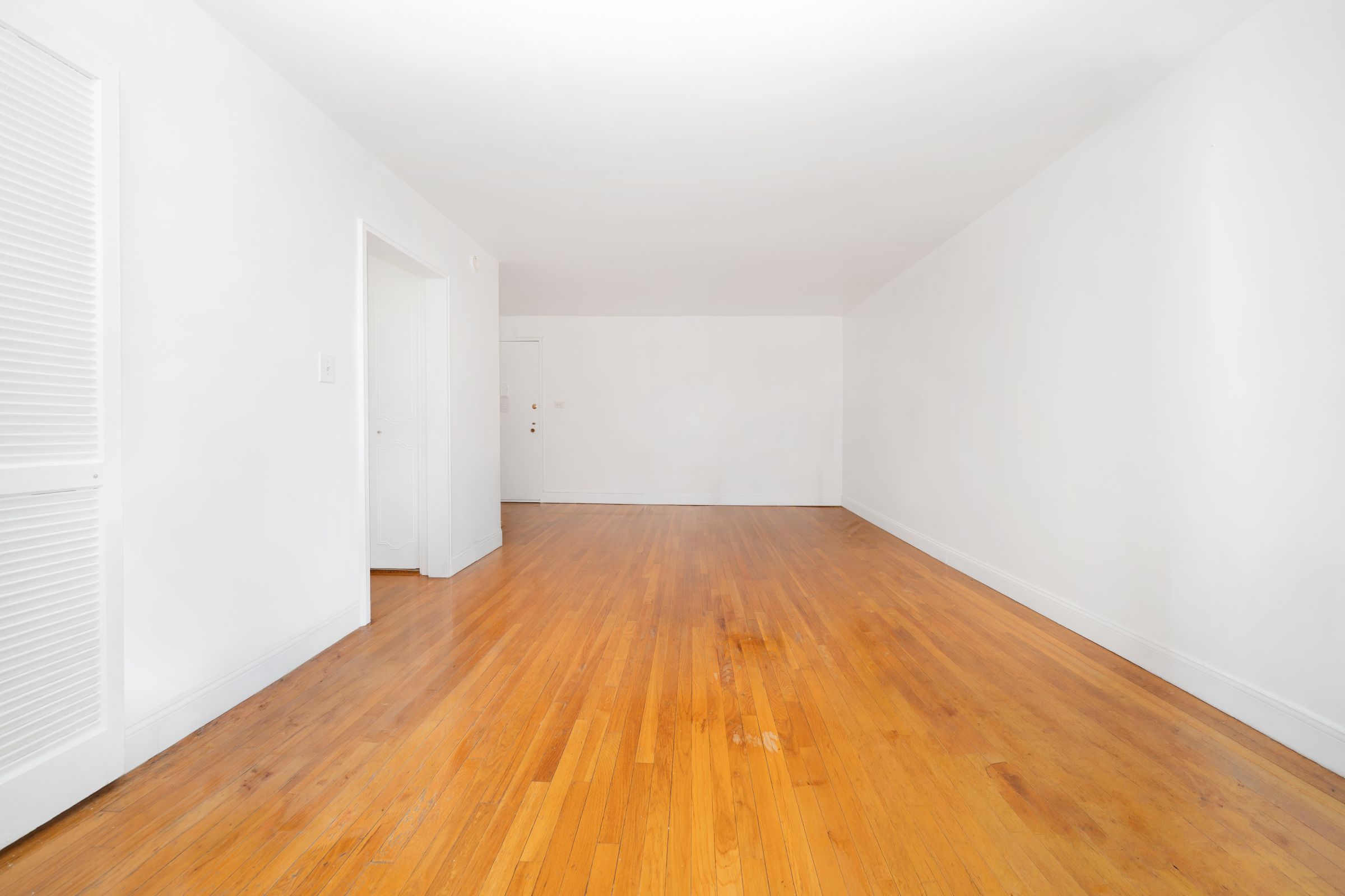 1270 East 51st Street, Unit 6M Brooklyn, NY 11234 - Photo 3 of 12 a view of empty room with wooden floor