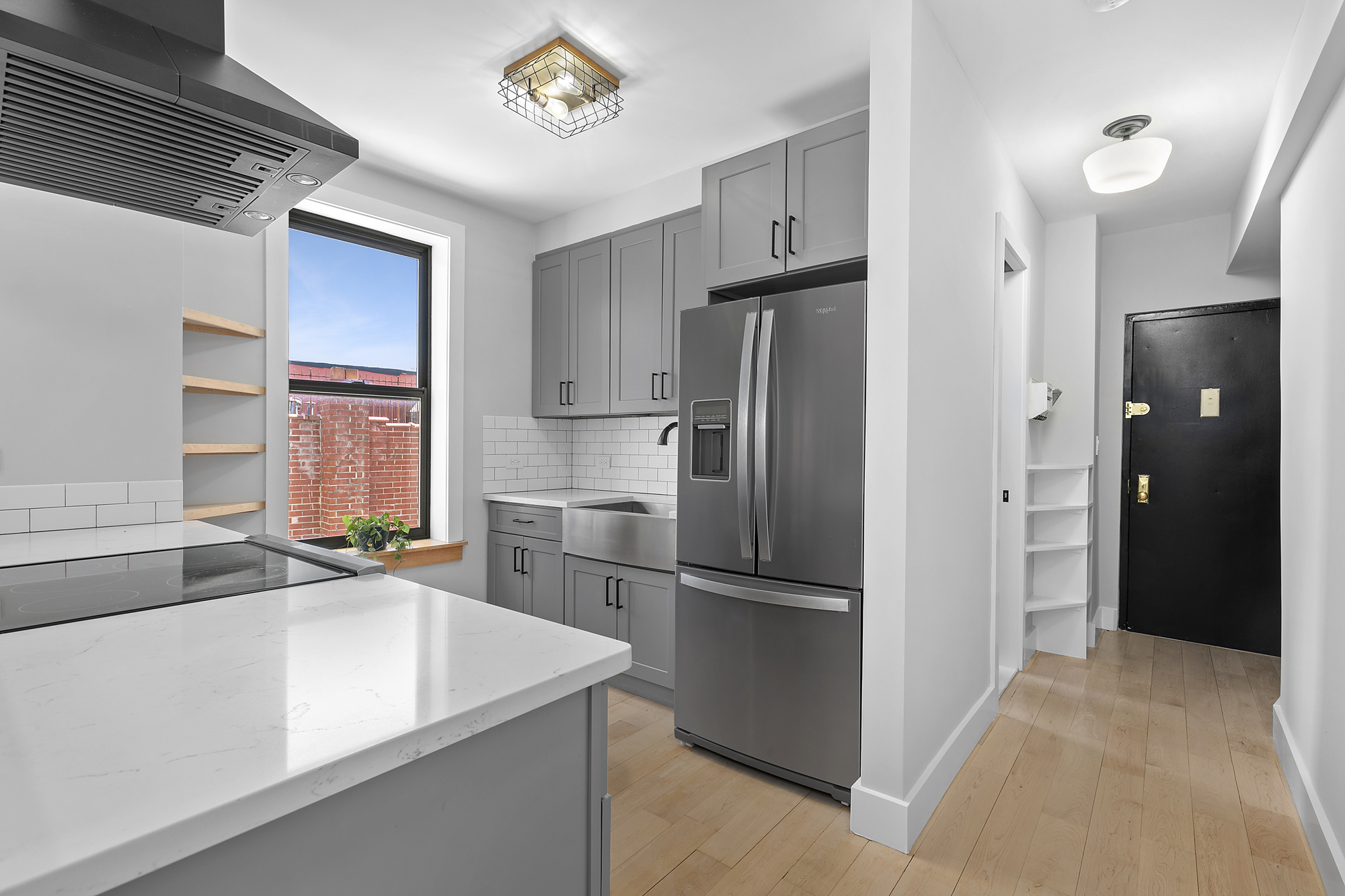 108 Division Avenue, Unit 22 Brooklyn, NY 11211 - Photo 3 of 11 a kitchen with stainless steel appliances granite countertop a refrigerator and a sink