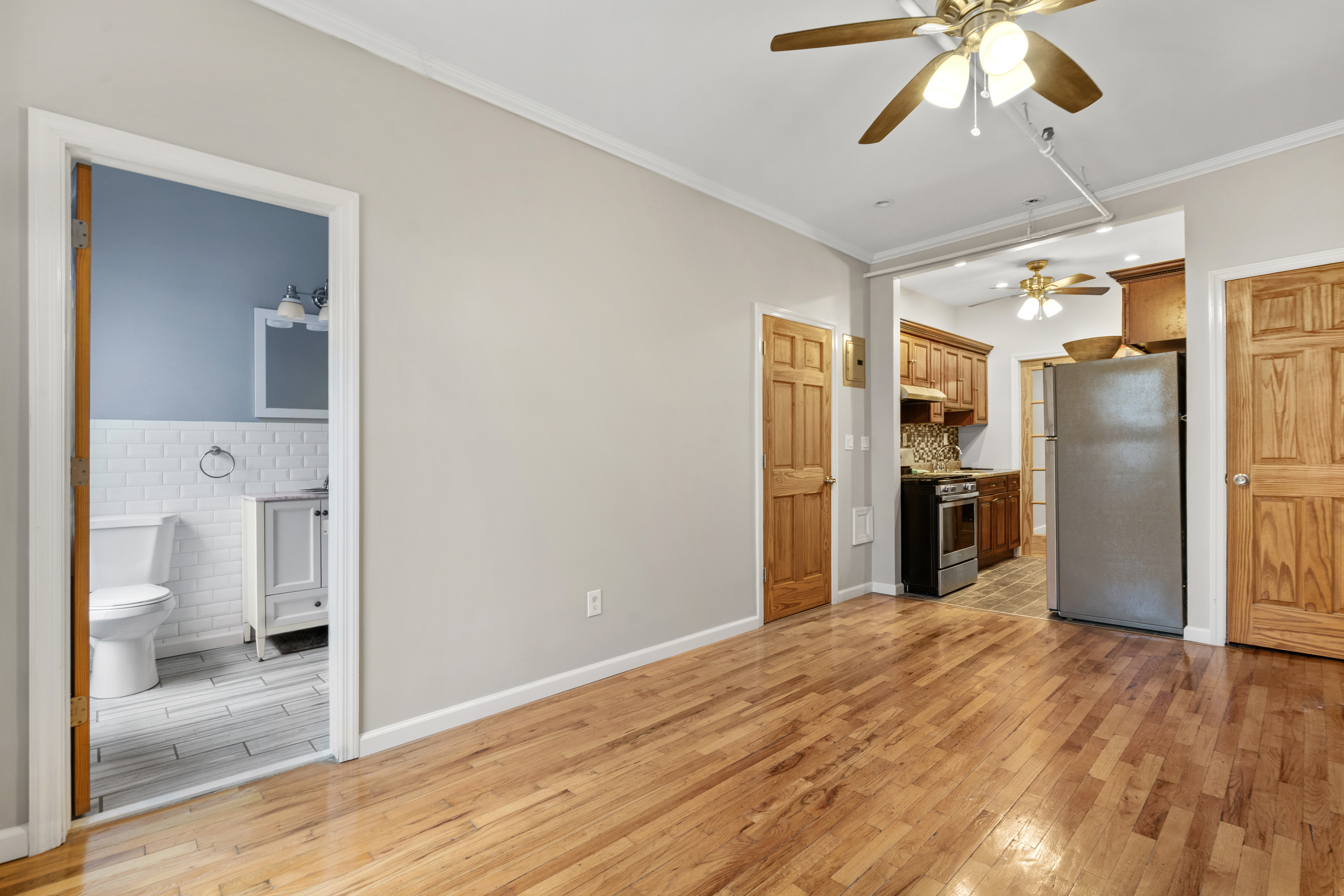 615 Putnam Avenue, Unit 4 Brooklyn, NY 11221 - Photo 5 of 10 a view of a kitchen with a sink and refrigerator
