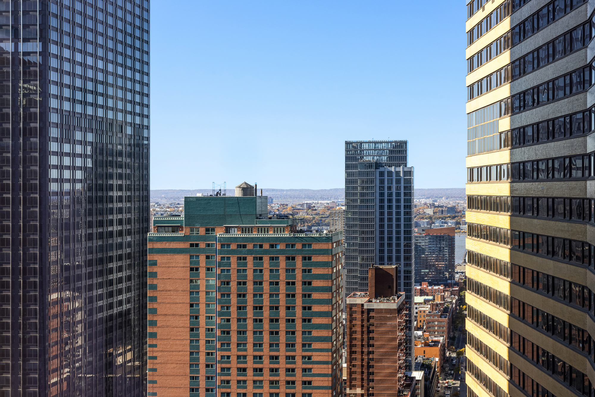 135 West 52nd Street, Unit 40A Manhattan, NY 10019 - Photo 23 of 24 a city view with tall buildings