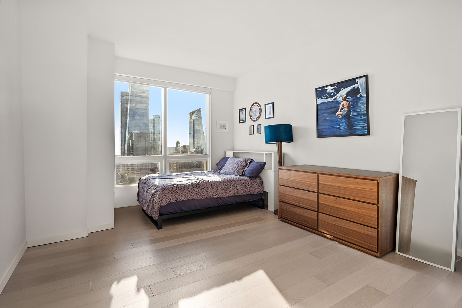 350 West 42nd Street, Unit 33G Manhattan, NY 10036 - Photo 10 of 20 a bedroom with a bed and a window