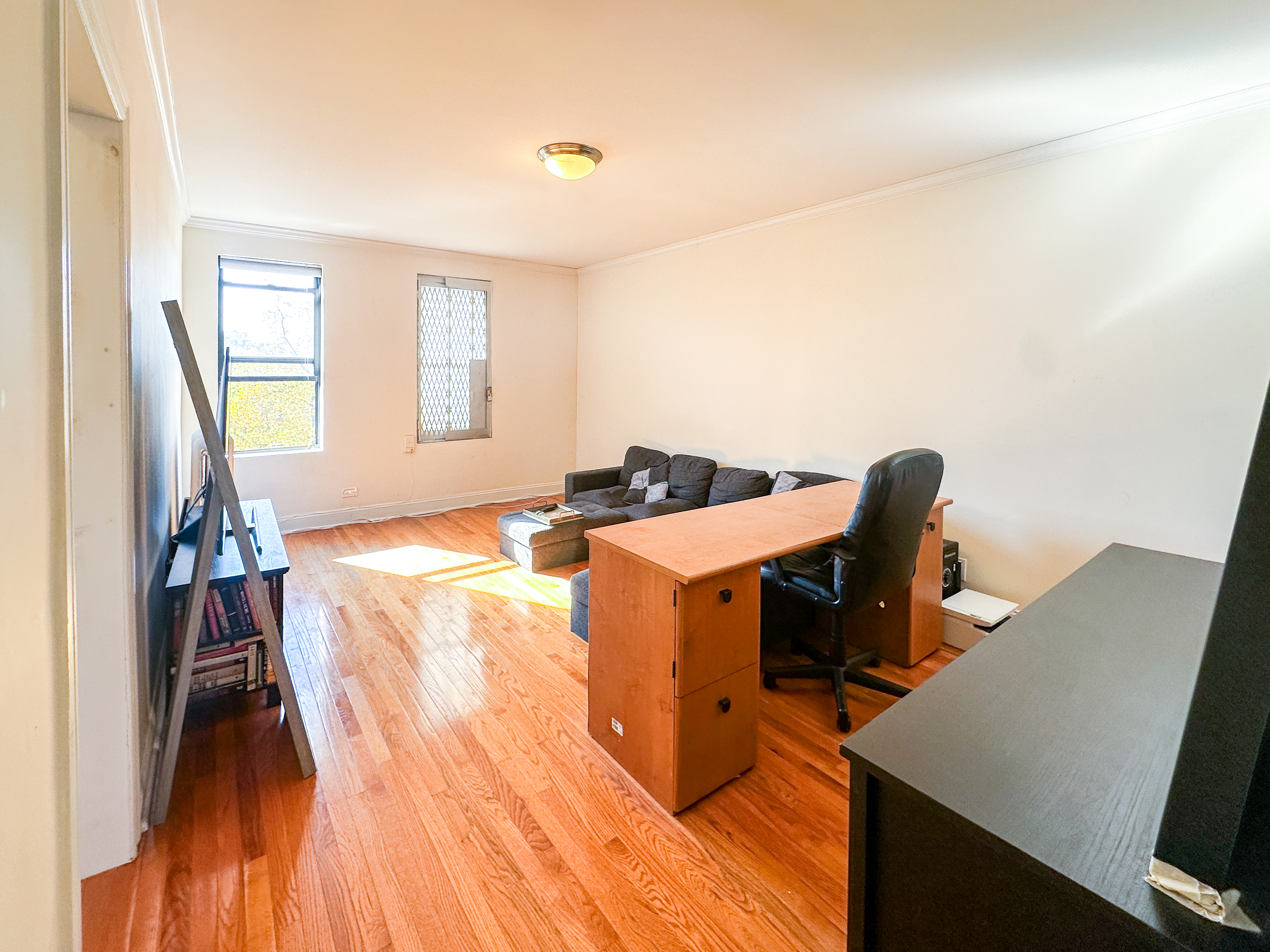 1506 Overing Street, Unit 1D Bronx, NY 10461 - Photo 7 of 10 a workspace with furniture and window