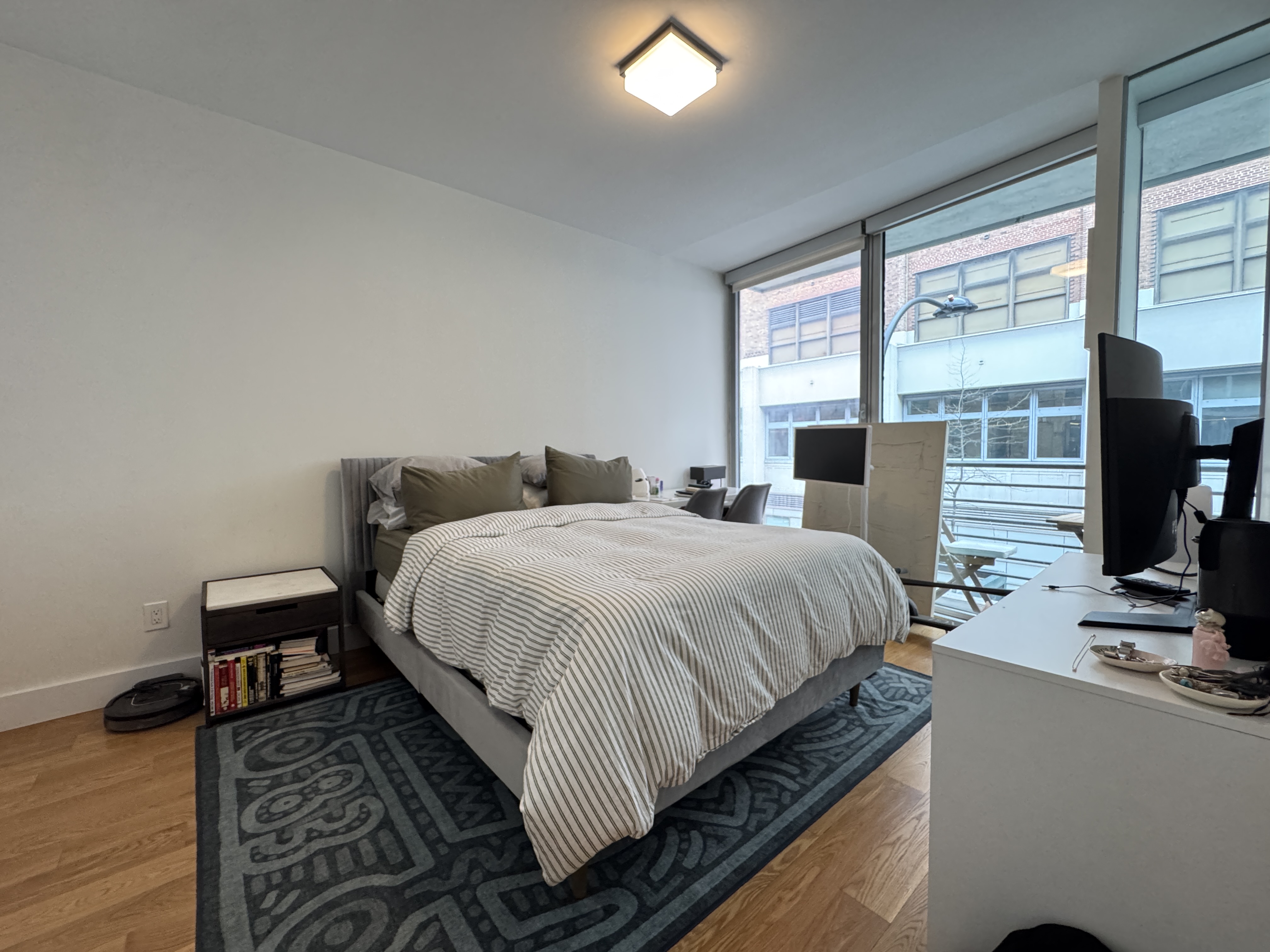343 West 16th Street, Unit 3F Manhattan, NY 10011 - Photo 6 of 10 a bedroom with a bed and wooden floor
