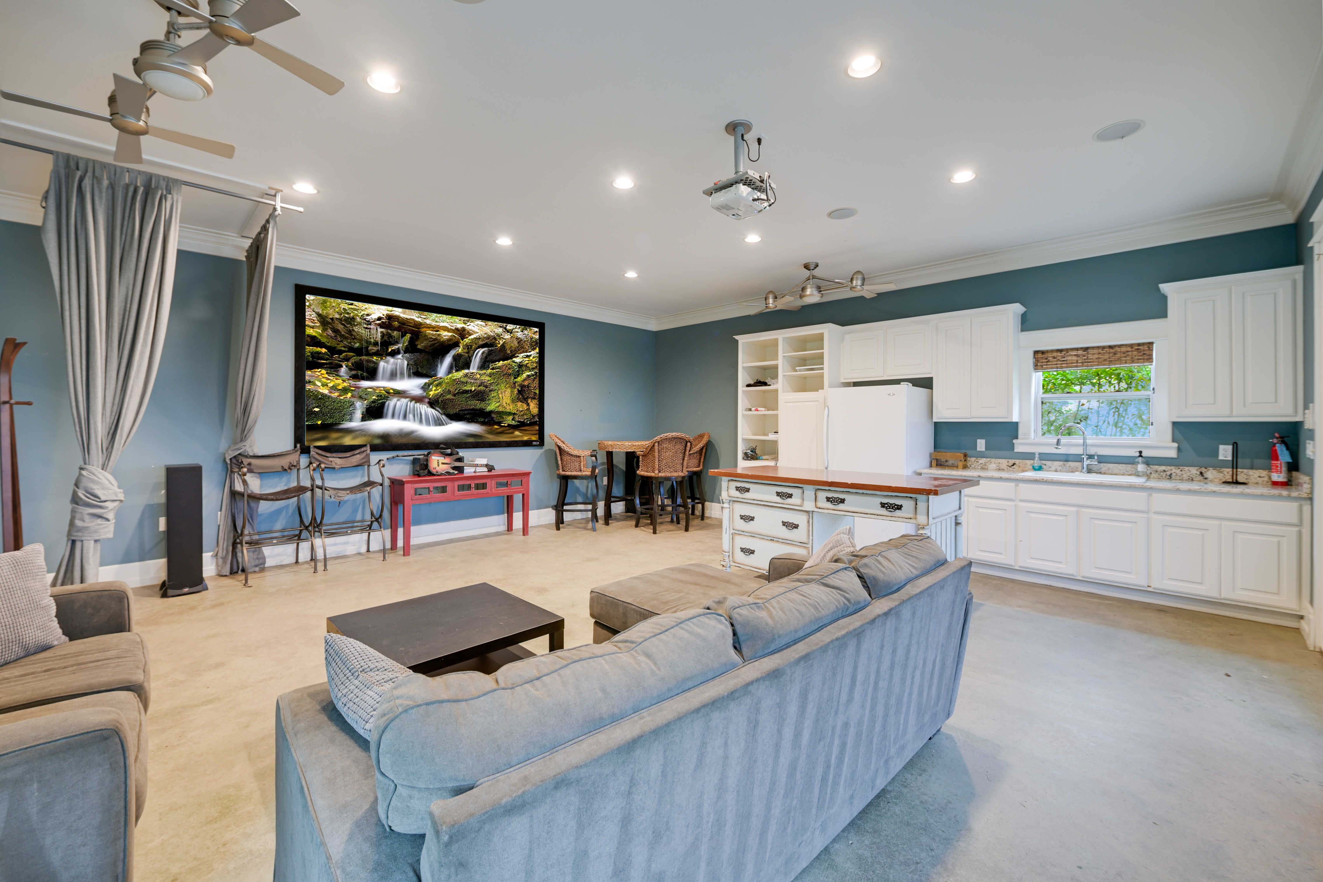 14913 Murfin Road Austin, TX 78734 - Photo 26 of 40 a living room with furniture and a flat screen tv