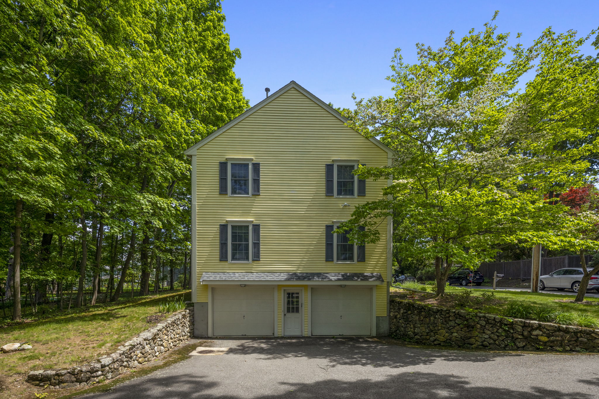 2 Laurel Street Lexington, MA 02421 - Photo 7 of 46 a front view of a house with a yard