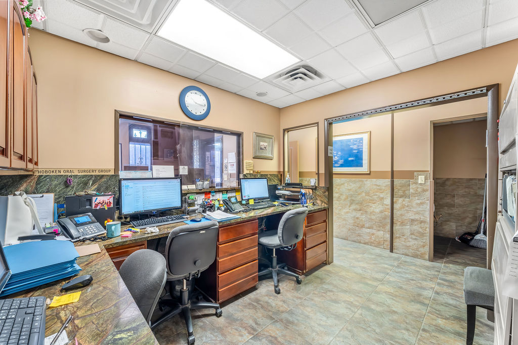 869 Bergen Avenue, Unit COMMERCIAL Jersey City, NJ 07306 - Photo 8 of 26 a room with furniture a rug and a window