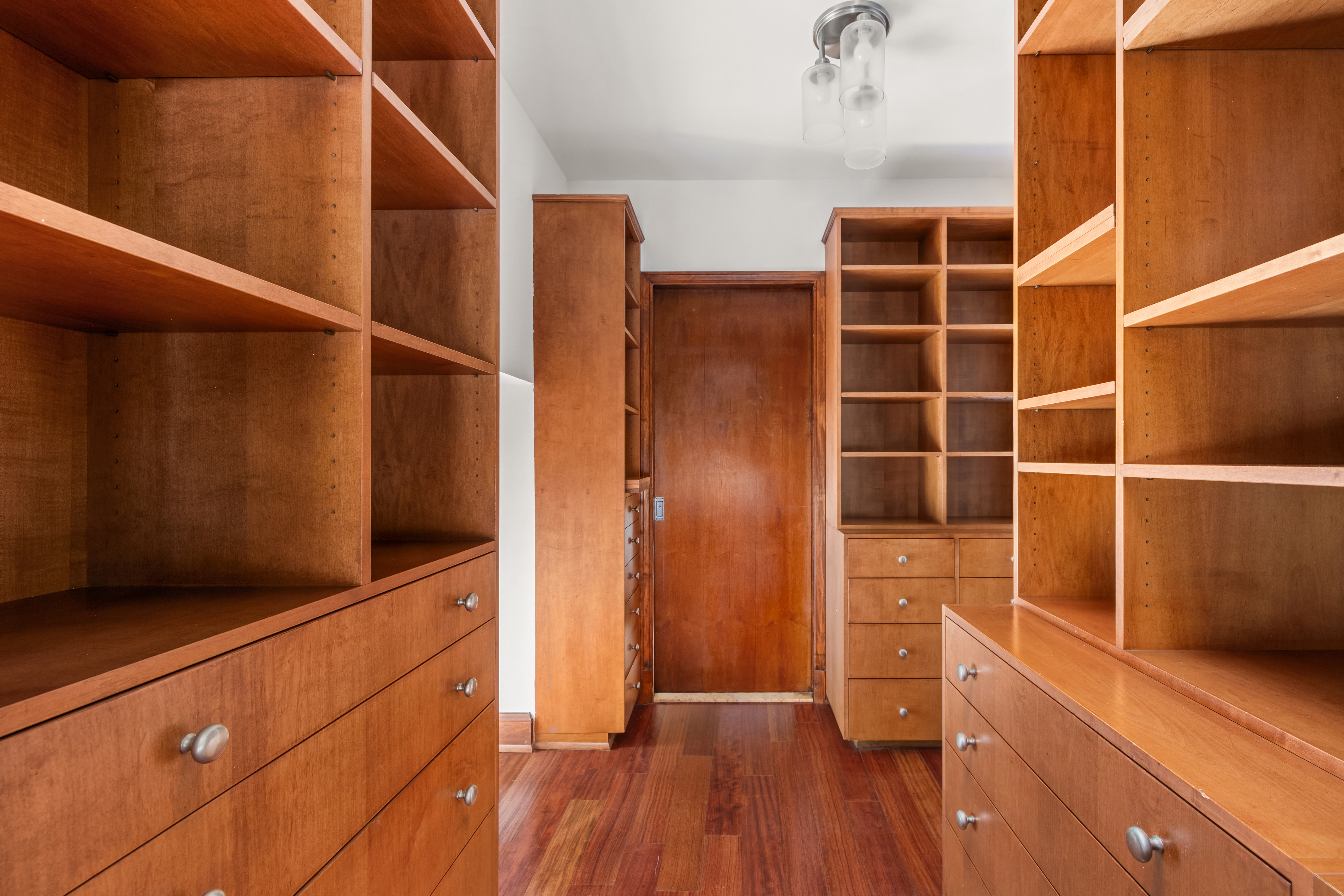 3 Hanover Square, Unit 22A Manhattan, NY 10004 - Photo 9 of 19 a view of walk in closet with empty racks