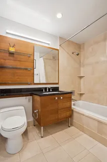 a bathroom with a toilet a sink and bathtub