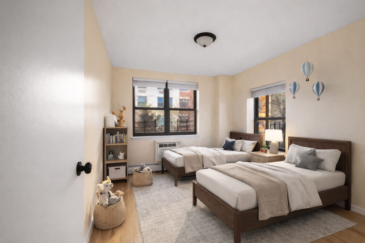 415 East 160th Street, Unit 3 Bronx, NY 10451 - Photo 5 of 10 a bedroom with two beds and a large window