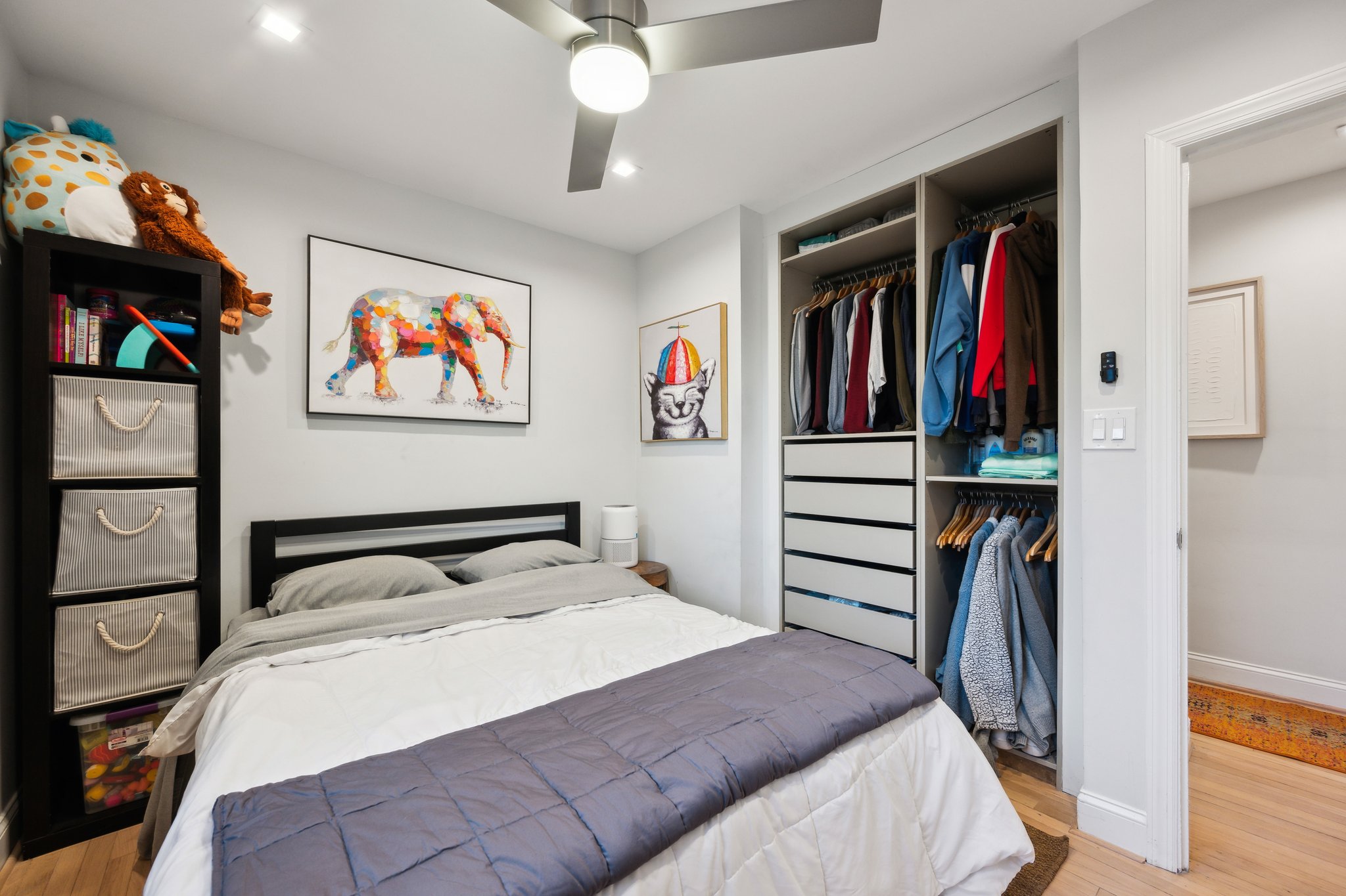2607 Ross Road Chevy Chase, MD 20815 - Photo 15 of 37 a bedroom with a bed and a book shelf