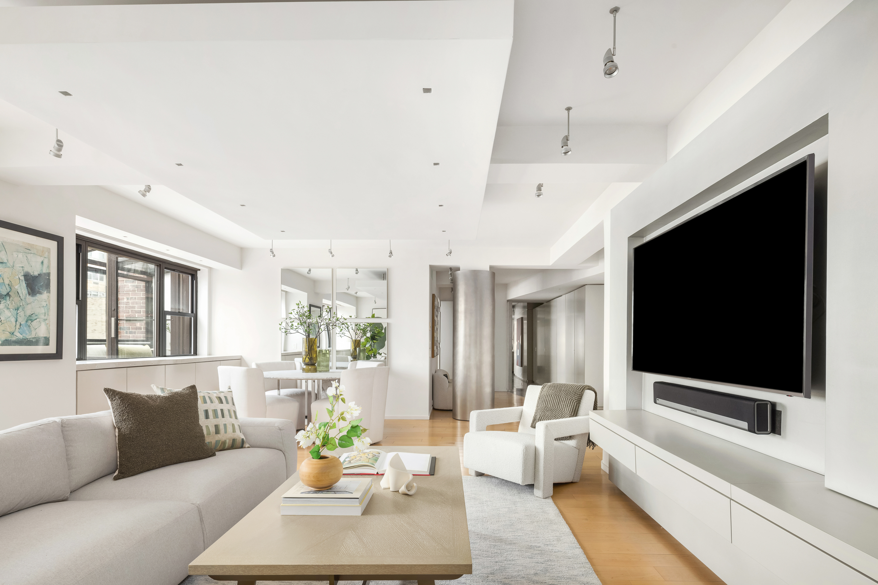 510 East 86th Street, Unit 17C Manhattan, NY 10028 - Photo 17 of 31 a living room with furniture and a flat screen tv