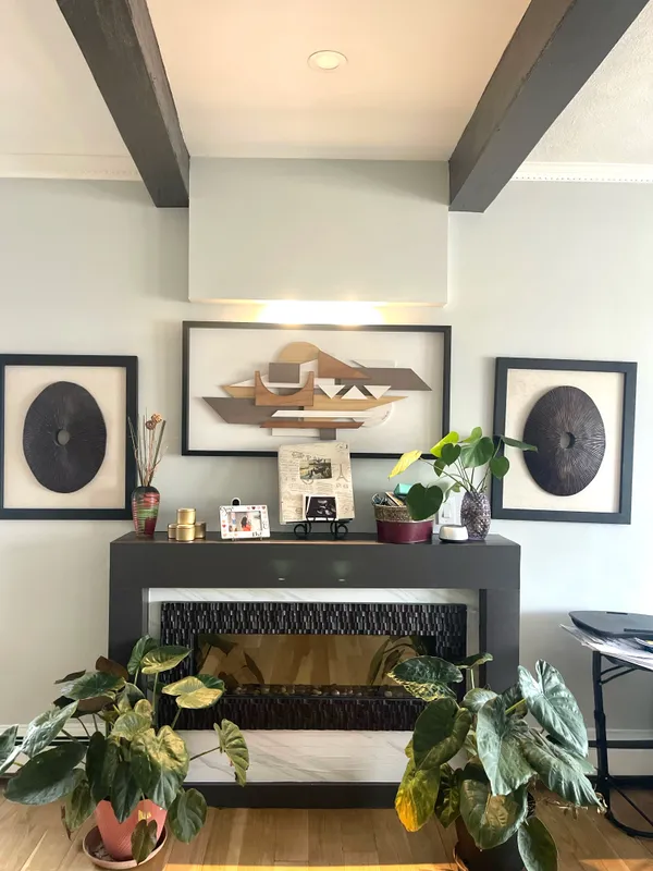 a living room with table and chairs