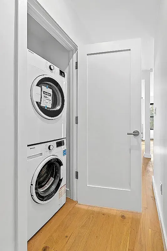 82 Clinton Avenue, Unit 4 Brooklyn, NY 11205 - Photo 9 of 11 a view of a storage & utility room with a washer dryer