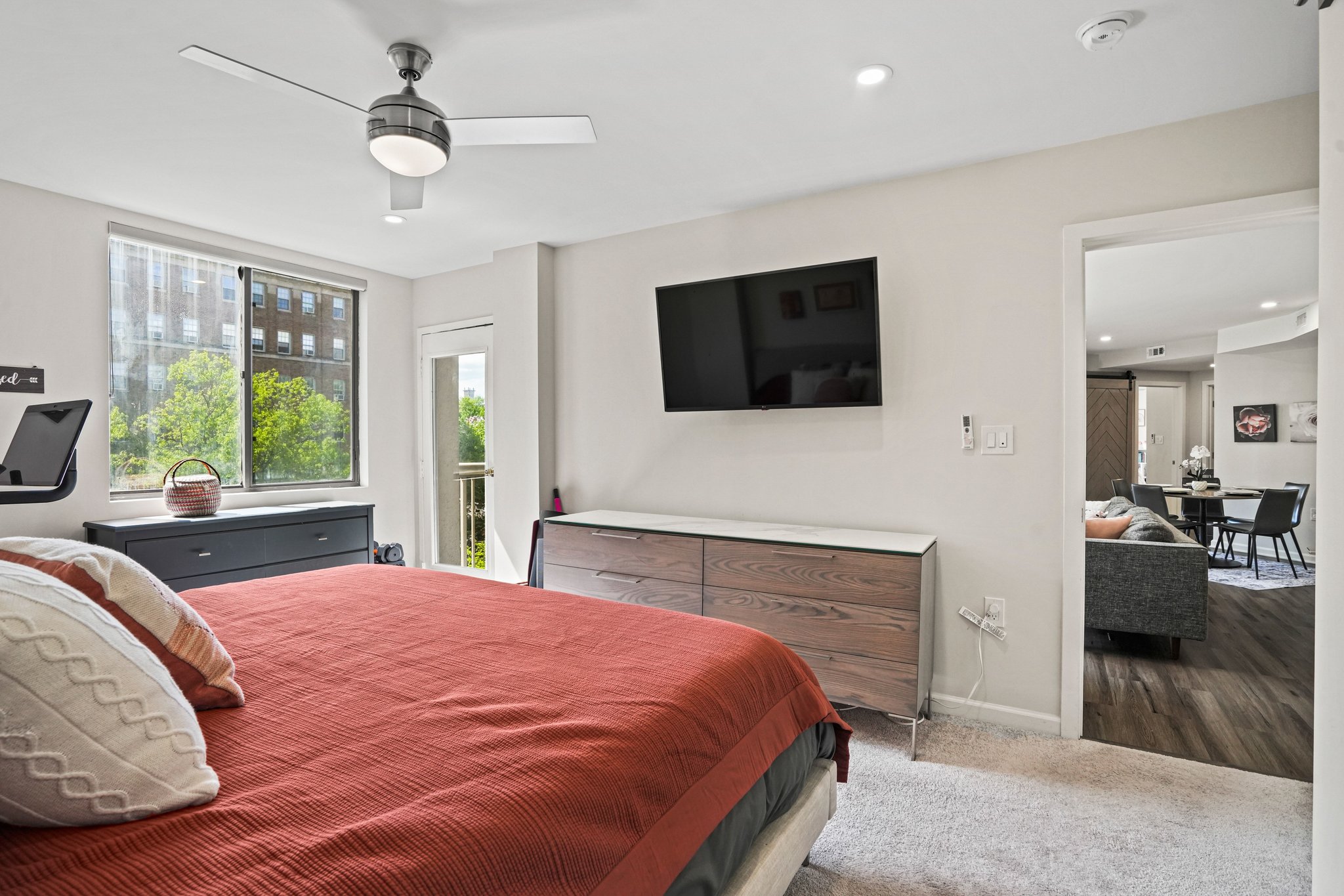 2725 Connecticut Avenue Northwest, Unit 507 Washington, DC 20008 - Photo 16 of 31 a bedroom with a large bed and a flat screen tv