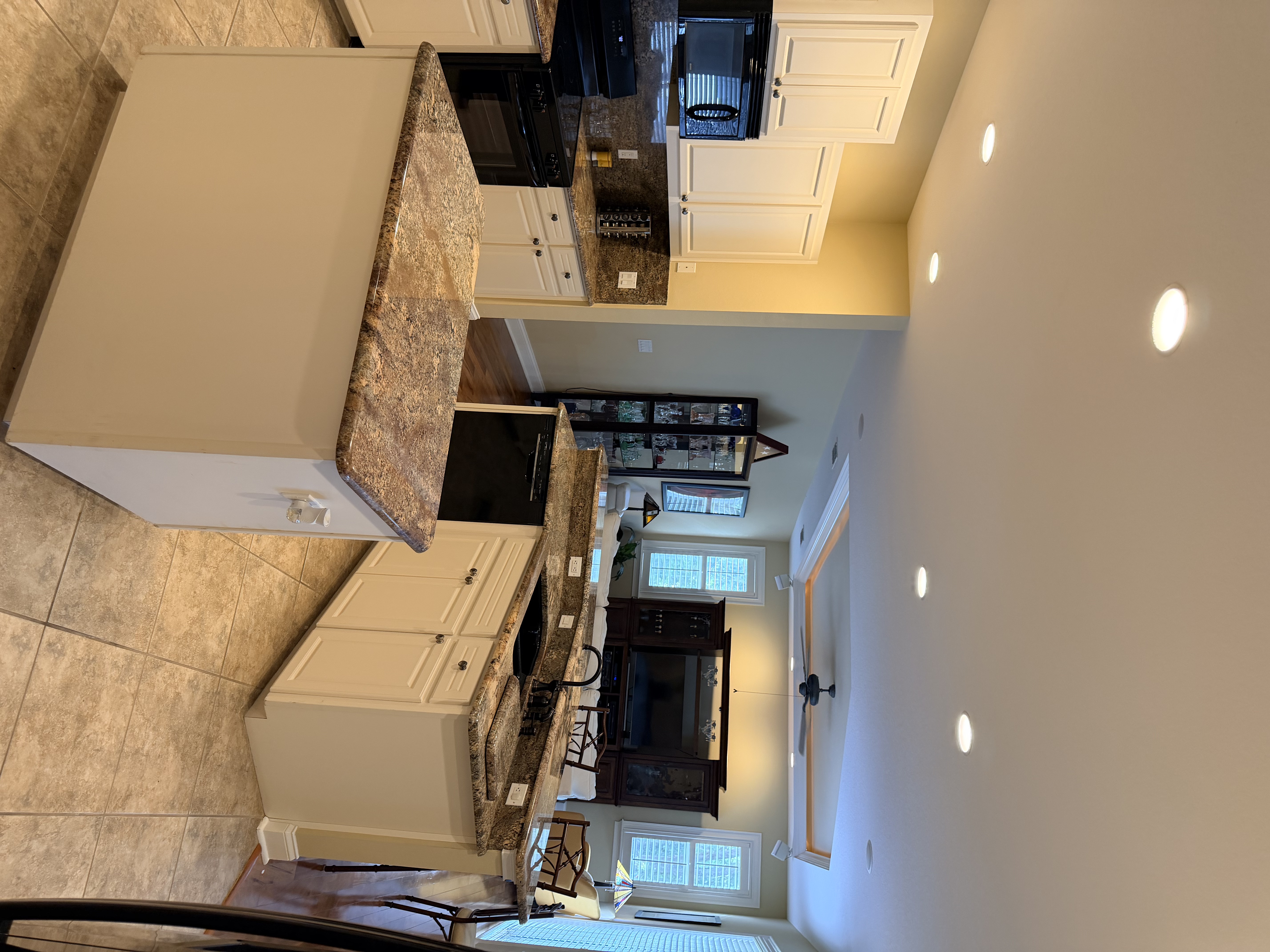 3196 Hawks Ridge Drive Lakeland, FL 33810 - Photo 6 of 14 a kitchen with stainless steel appliances kitchen island granite countertop a stove top oven a sink a counter top space and cabinets