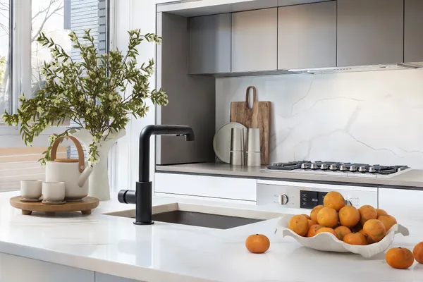 a kitchen with a sink and cabinets