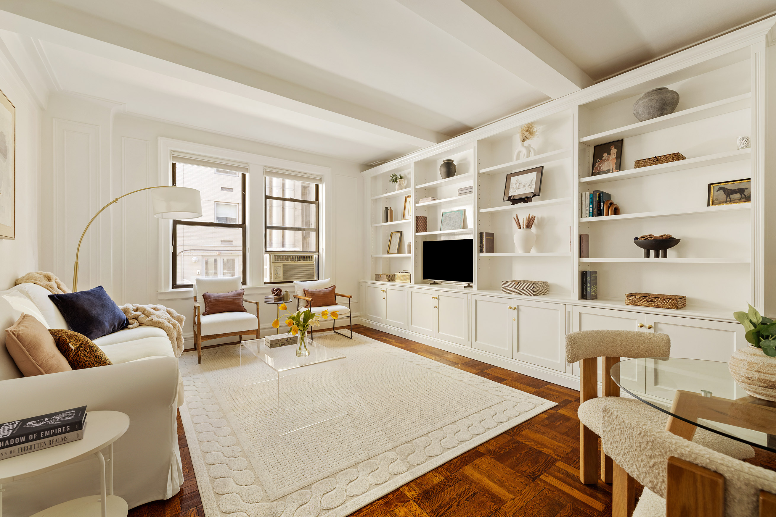 119 East 84th Street, Unit 4C Manhattan, NY 10028 - Photo 1 of 9 a living room with furniture and a flat screen tv