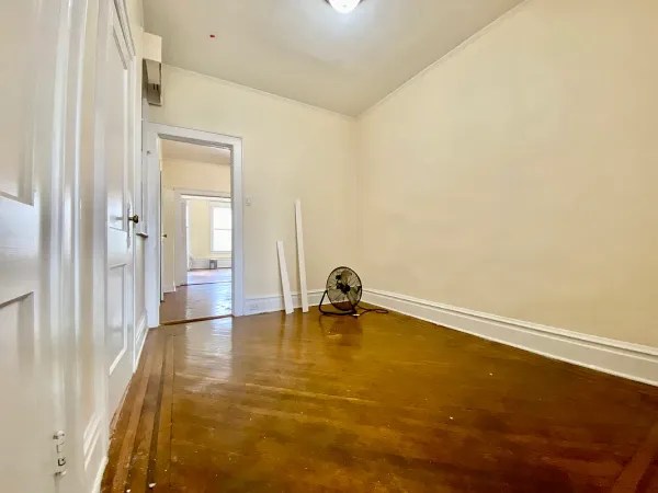 a room with a table and a potted plant