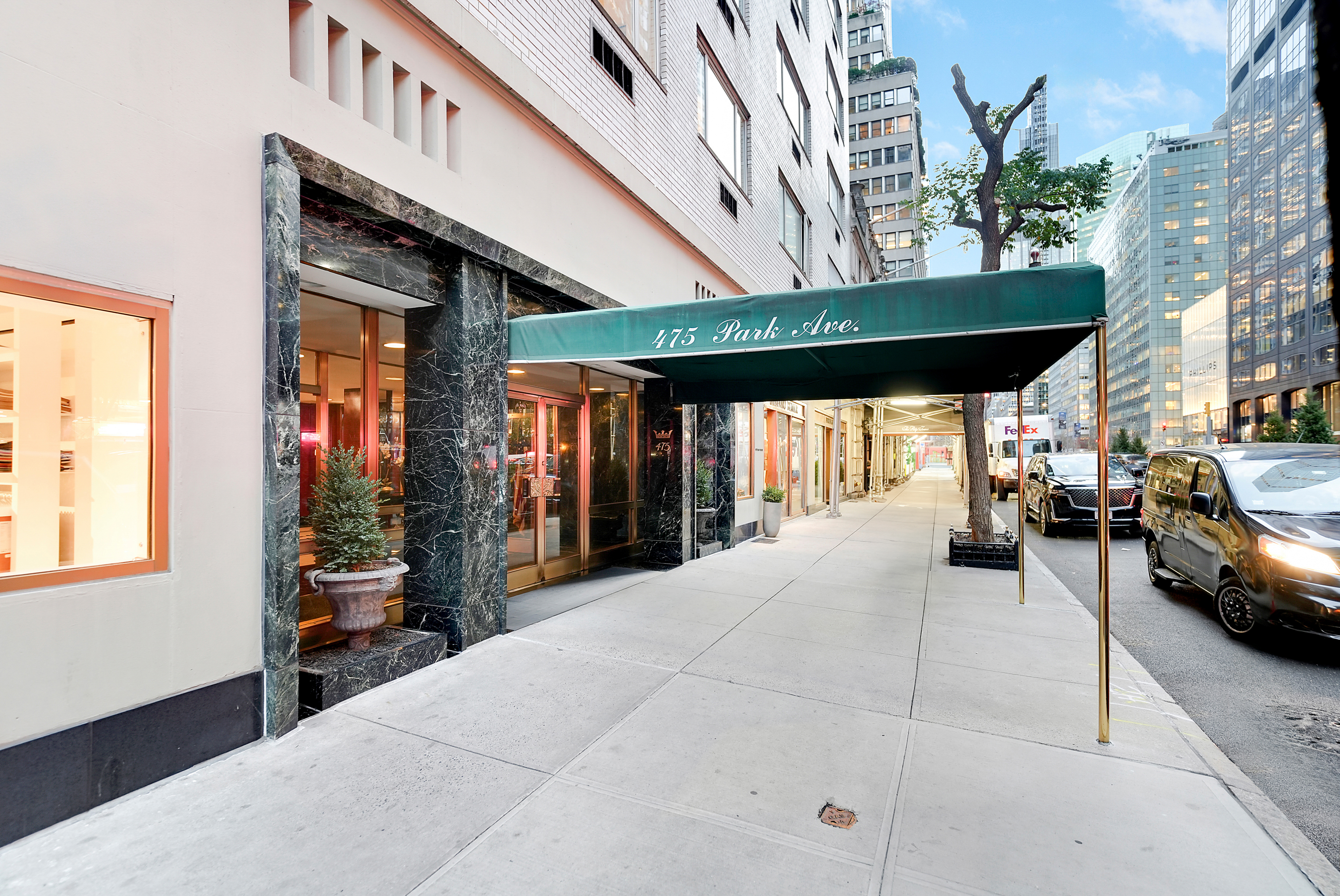 475 Park Avenue, Unit 3D5 Manhattan, NY 10022 - Photo 16 of 18 a building outdoor space with patio furniture and potted plants