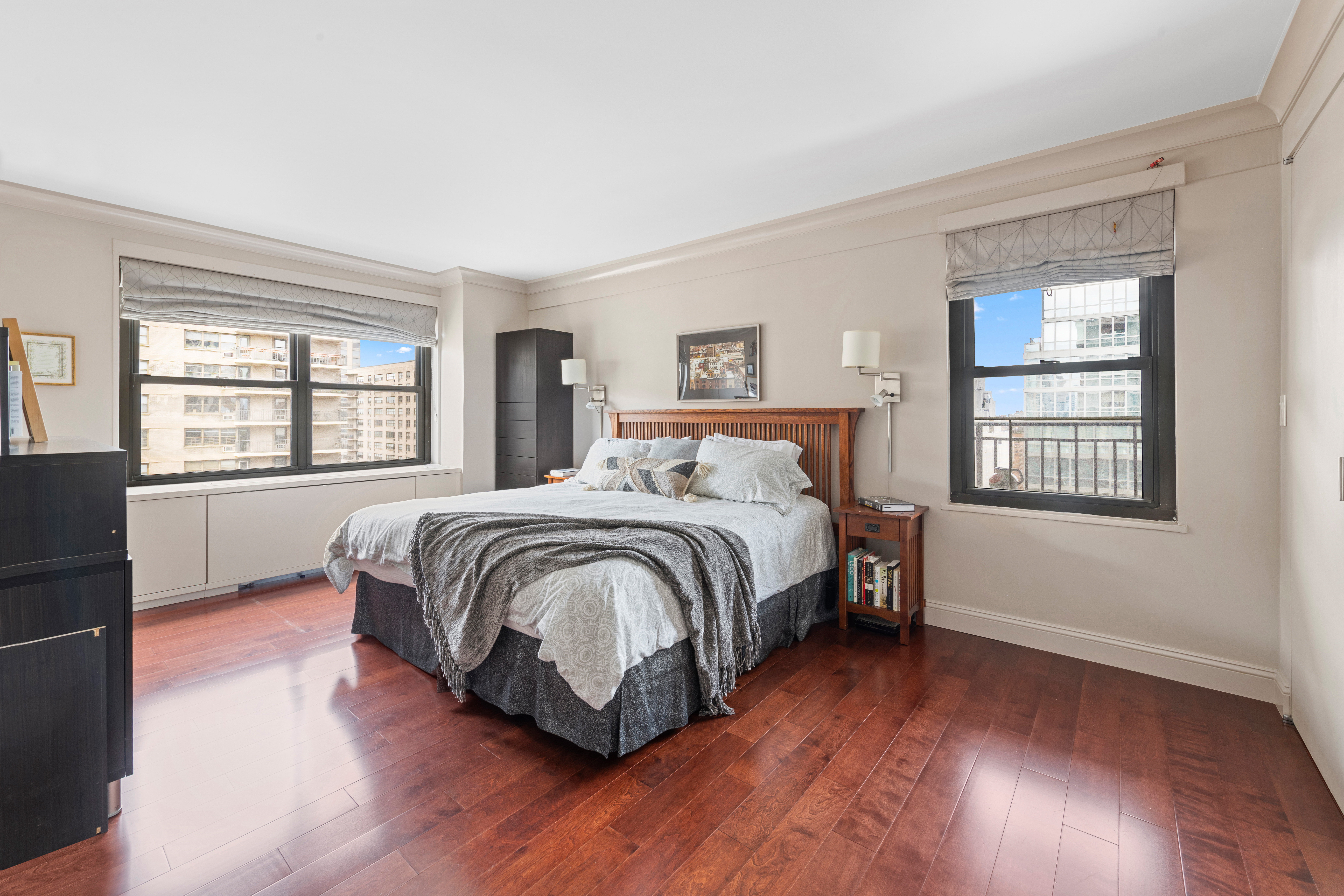 180 West End Avenue, Unit 25M Manhattan, NY 10023 - Photo 5 of 11 a bedroom with a bed and wooden floor