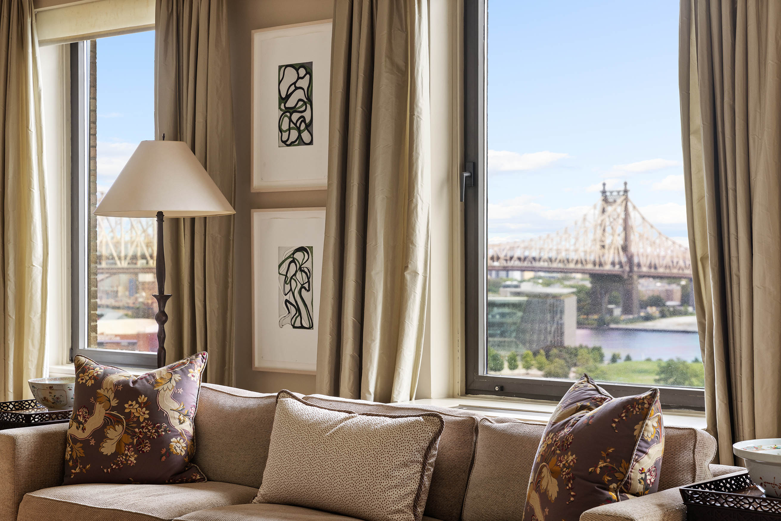 435 East 52nd Street, Unit 11A Manhattan, NY 10022 - Photo 3 of 21 a living room with furniture and a window